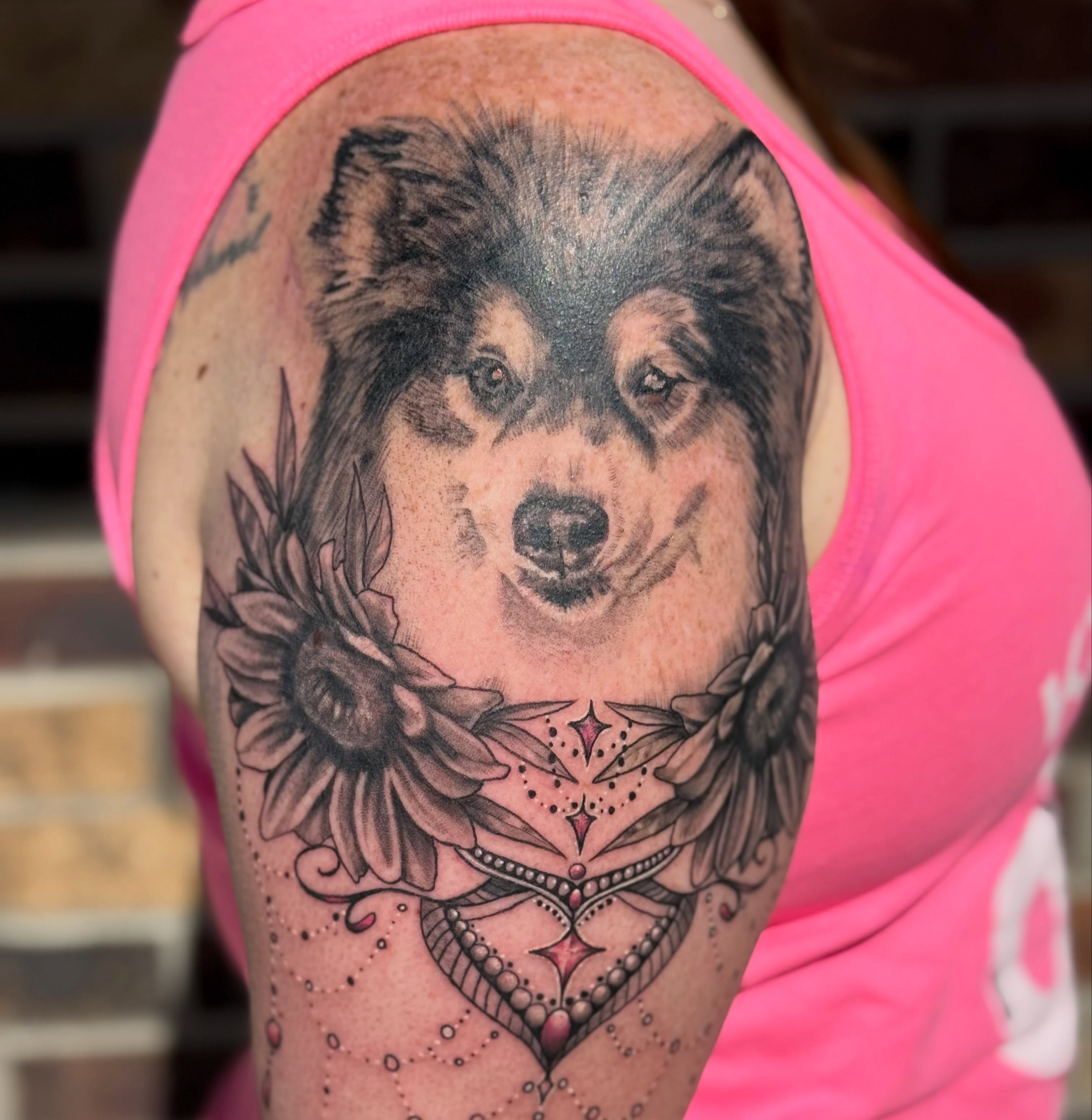 Wolf and sunflowers realism tattoo on the shoulder by Lauren Horness