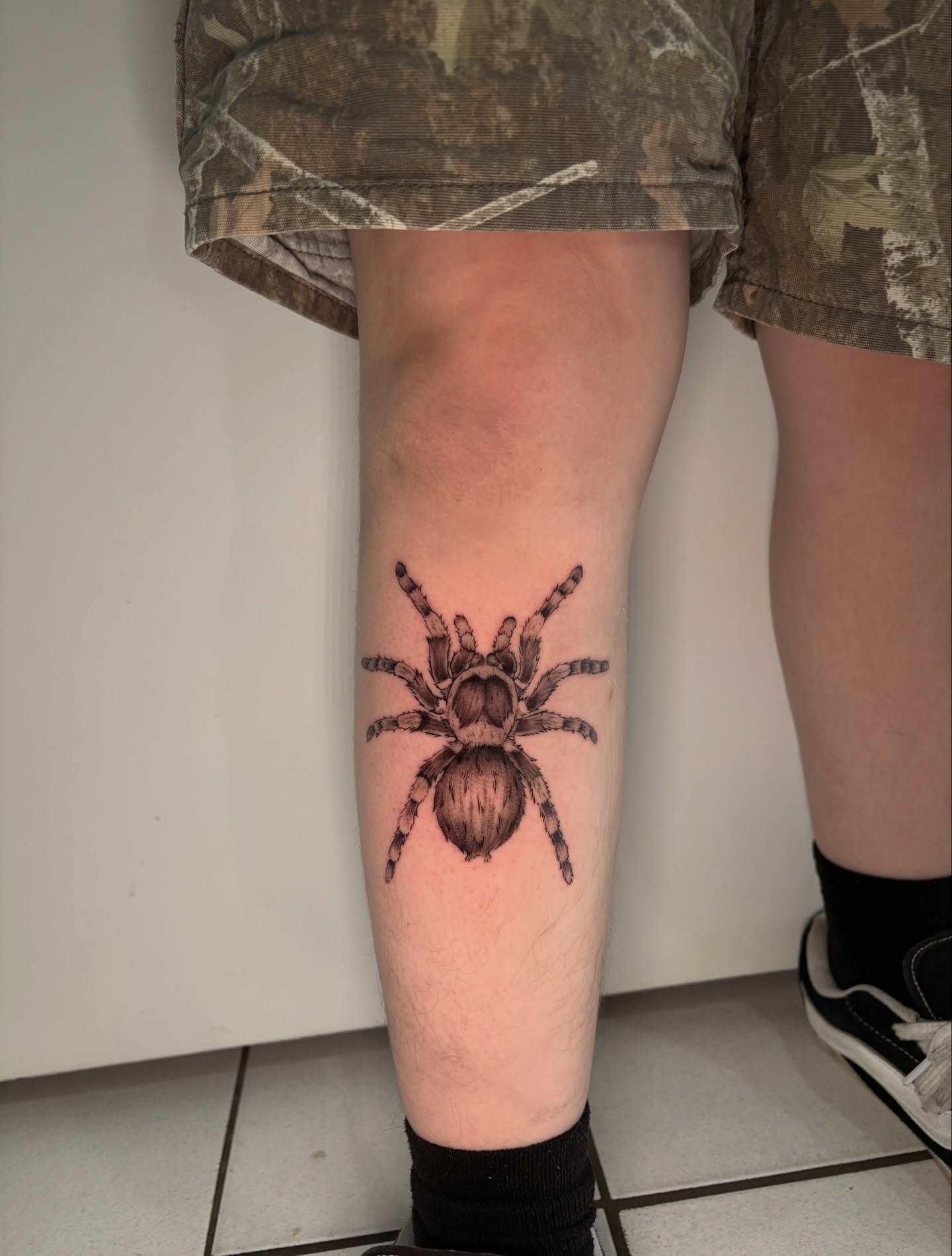 Spider realism tattoo on the leg by Chloe Shay