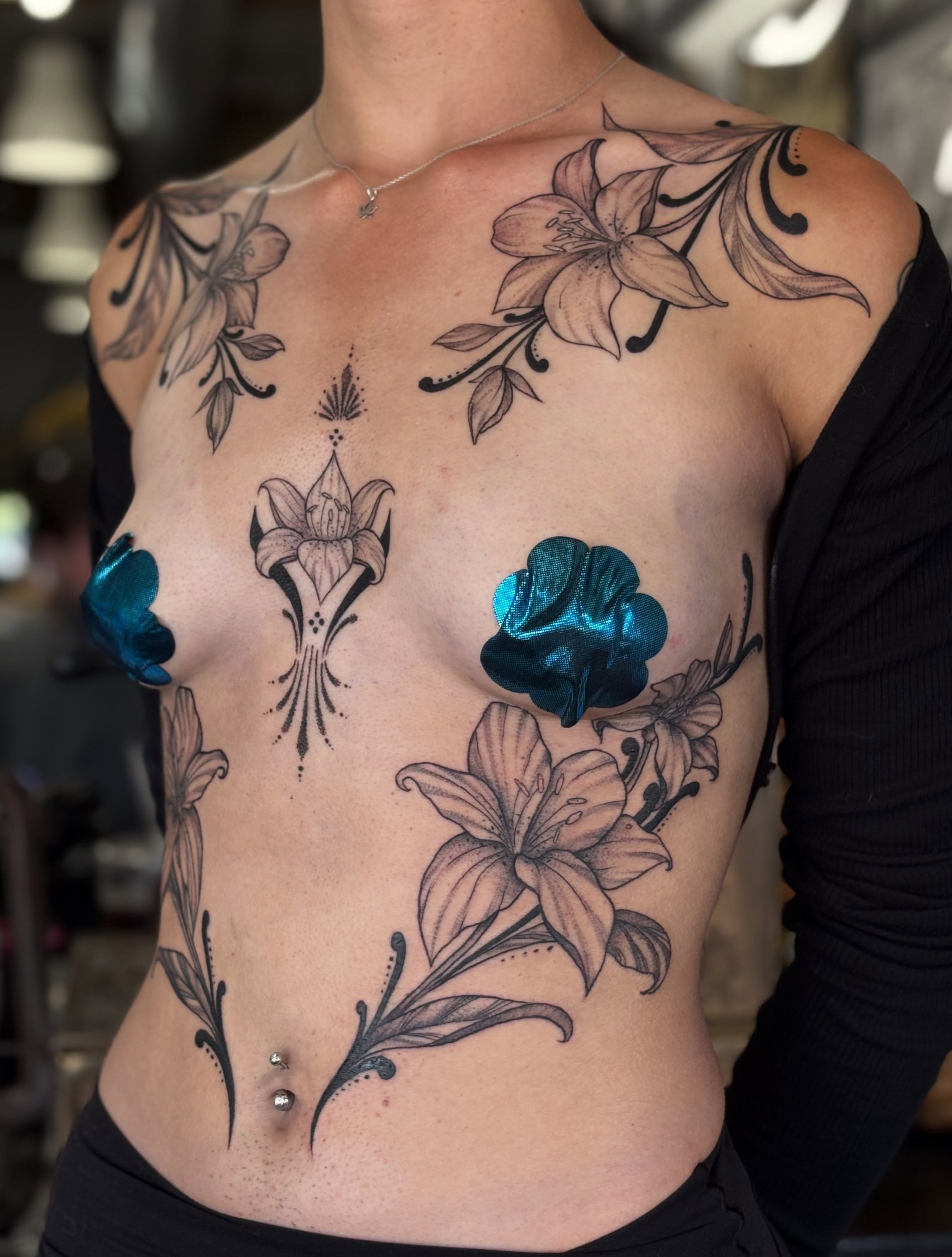 Lilies and clovers black and grey tattoo on the chest by ✤ Ornamental Tattoo Artist ✤