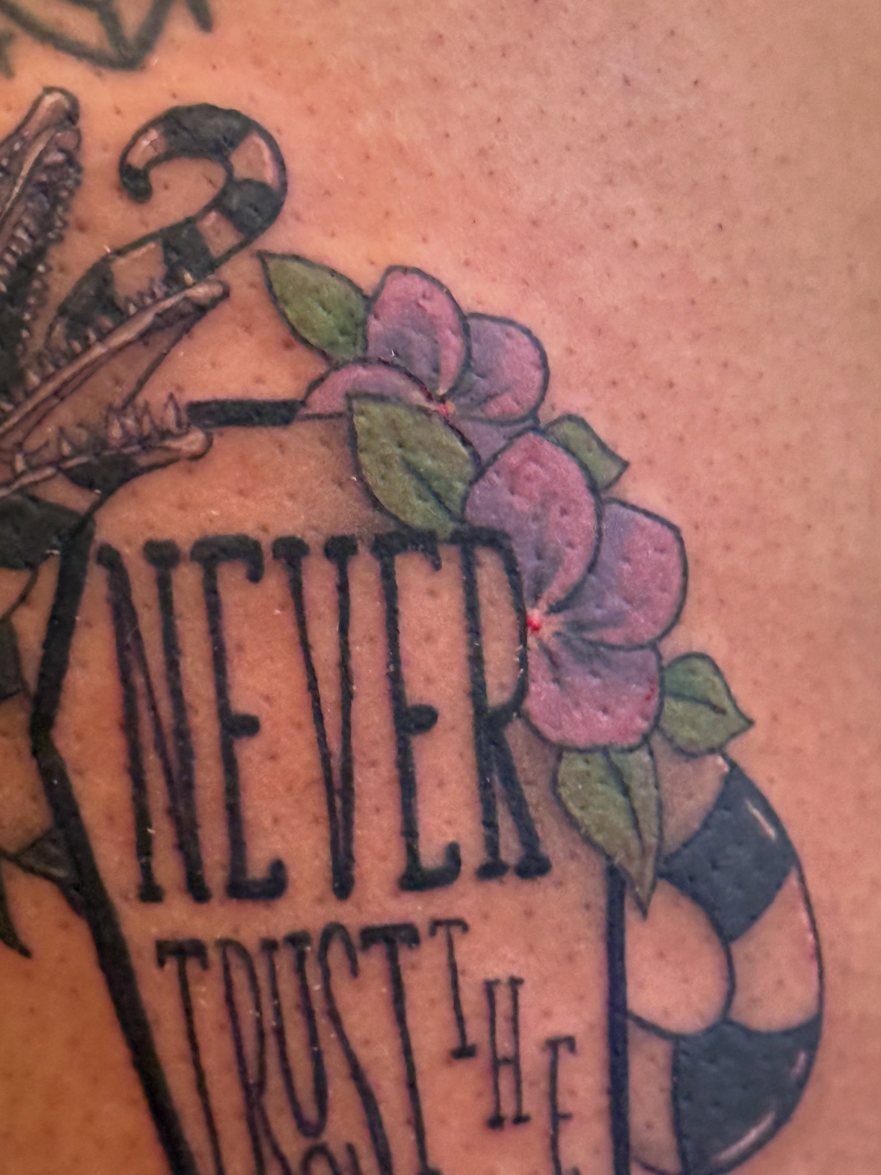 Never trust the American traditional tattoo on the back by Lauren Horness
