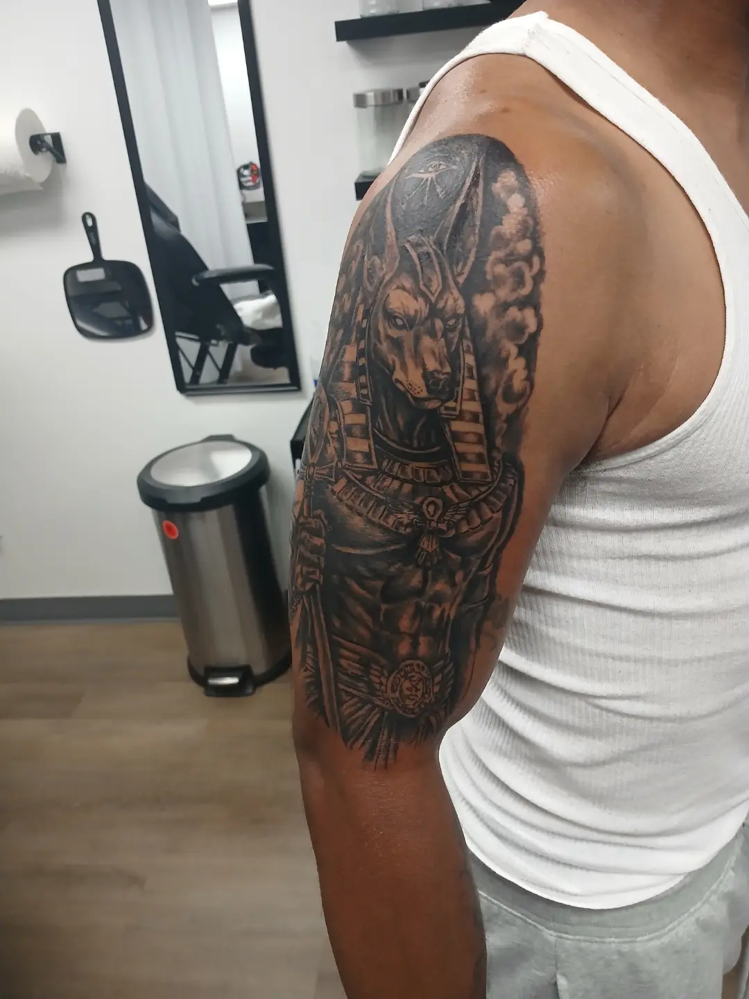 Ancient egyptian god realism tattoo on the upper arm by Tattoos by Fesik LLC