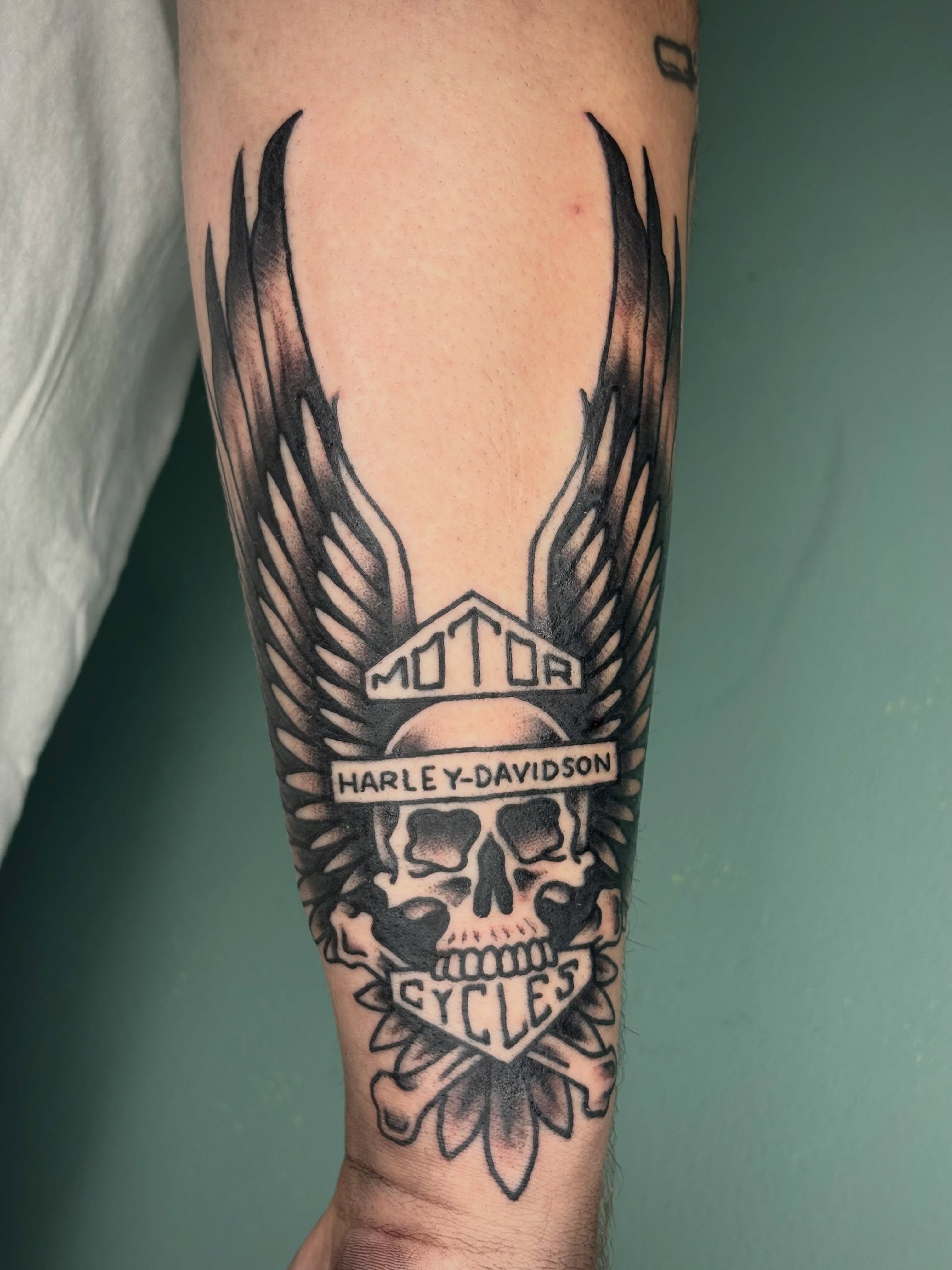 Harley-Davidson skull realism tattoo on the forearm by Sydney Pflaumer