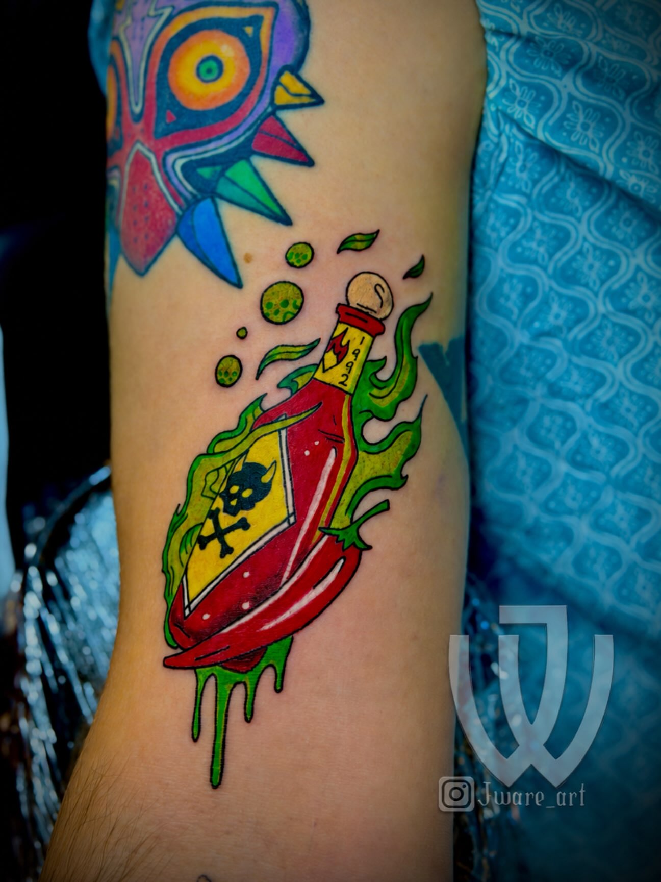 Poison bottle new school tattoo on the forearm by Joshua Ware, Alvarado, Texas