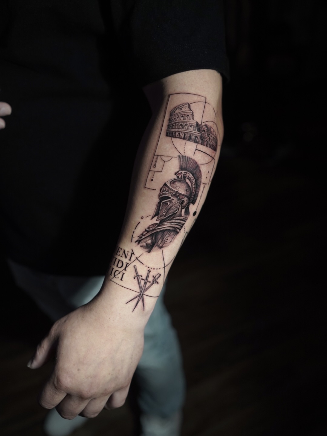 Roman soldier and colosseum black and grey tattoo on the forearm by Niko Hosk Cataldo