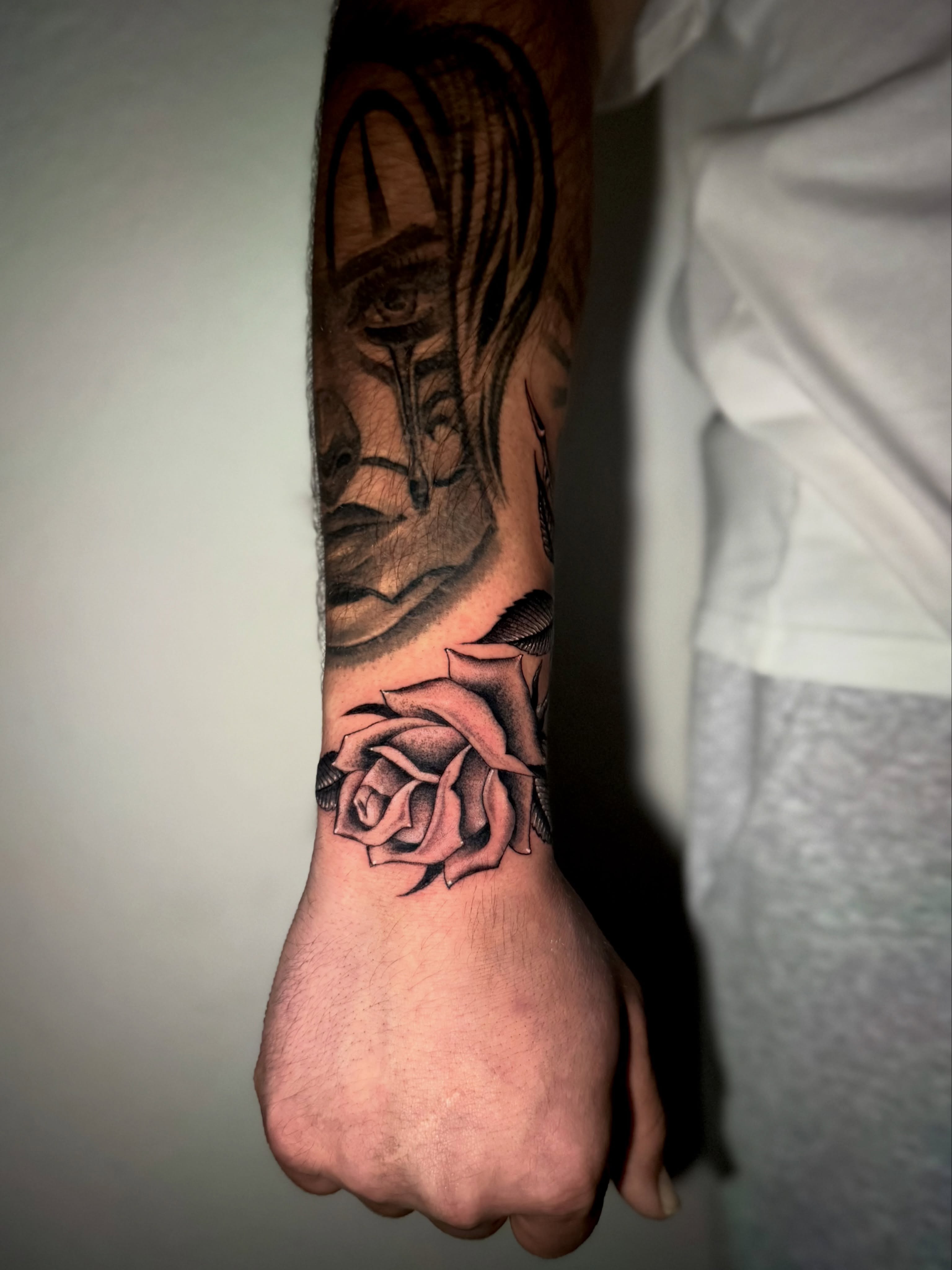 Rose and portrait realism tattoo on the forearm by @sadfoo_tattoo, Austin, Texas
