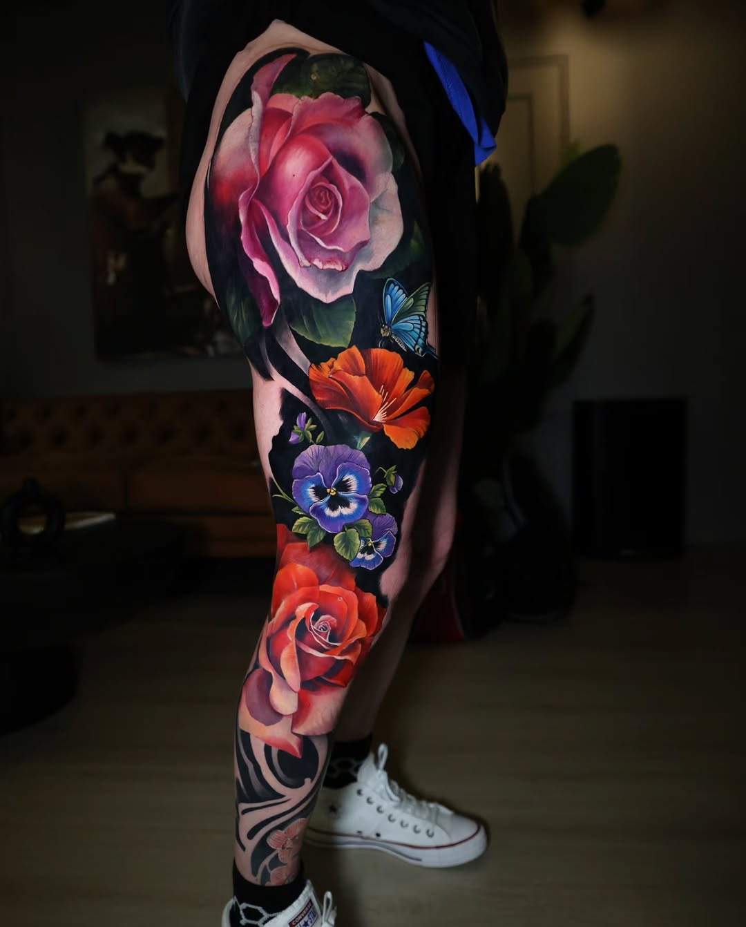 Roses and butterflies neo-traditional tattoo on the leg by Marek Pawlik