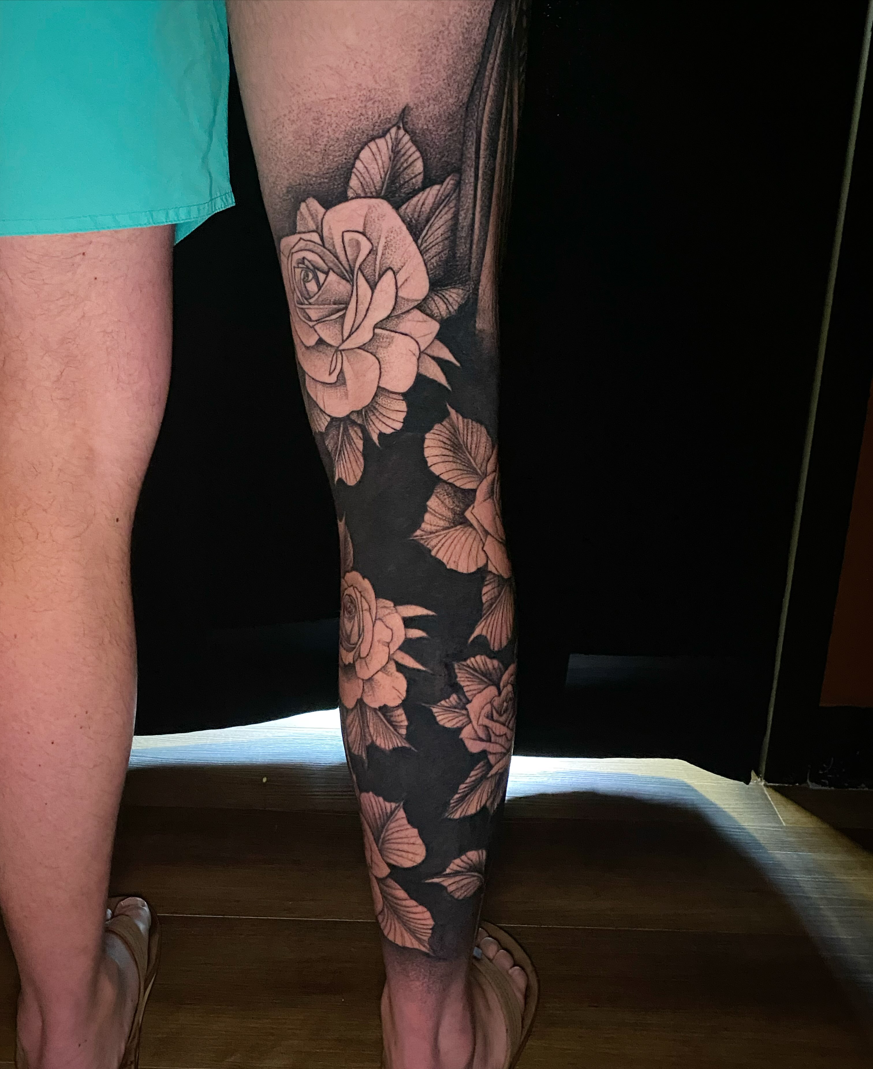 Roses dotwork tattoo on the calf by Casey Dohner