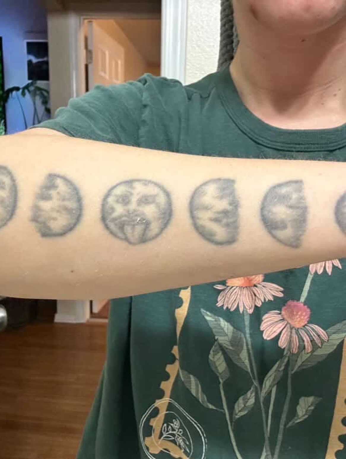 Moon phases black and grey tattoo on the forearm by Reilley Earles