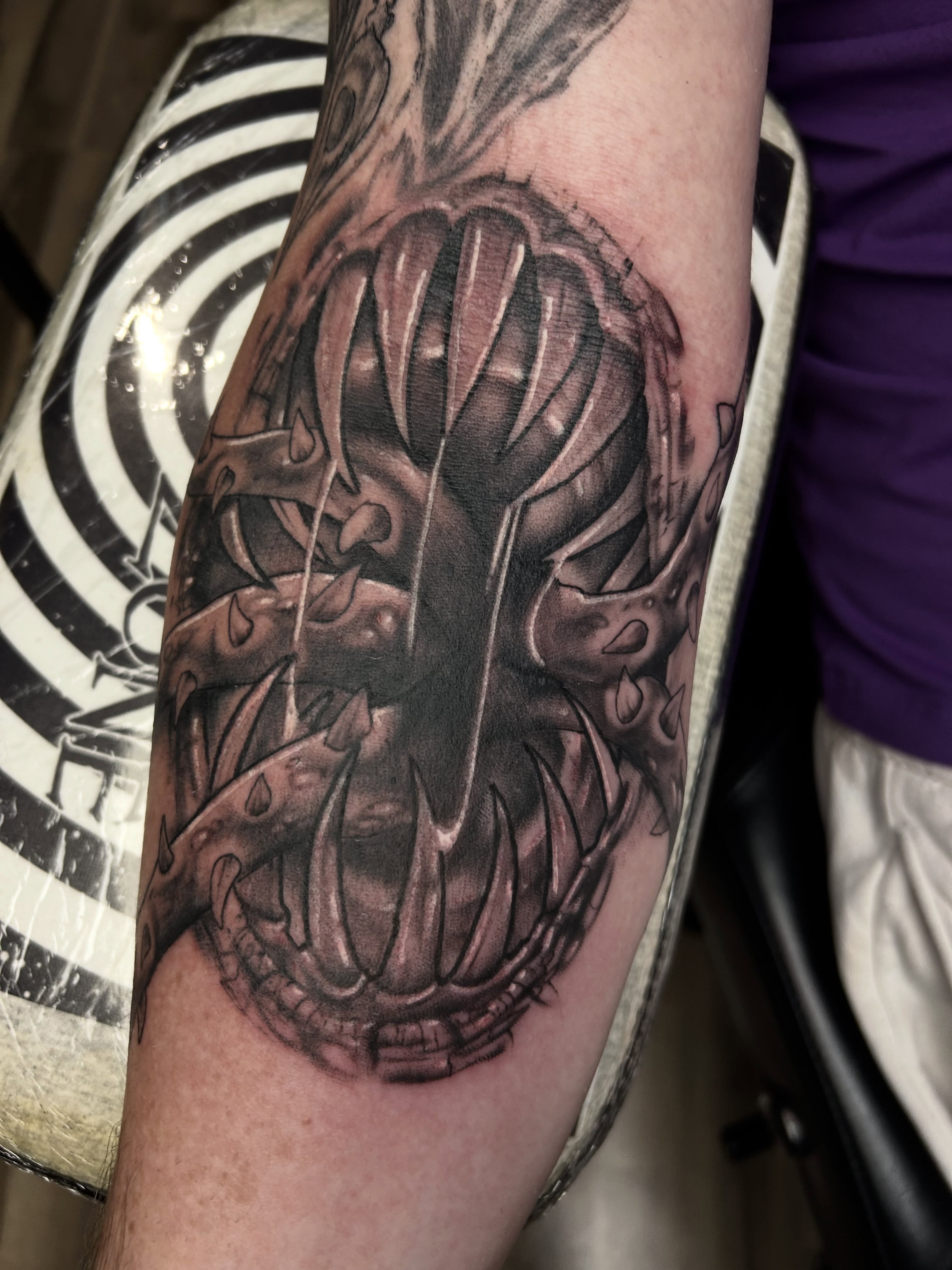 Skull dark realism tattoo on the forearm by Dan Schuster