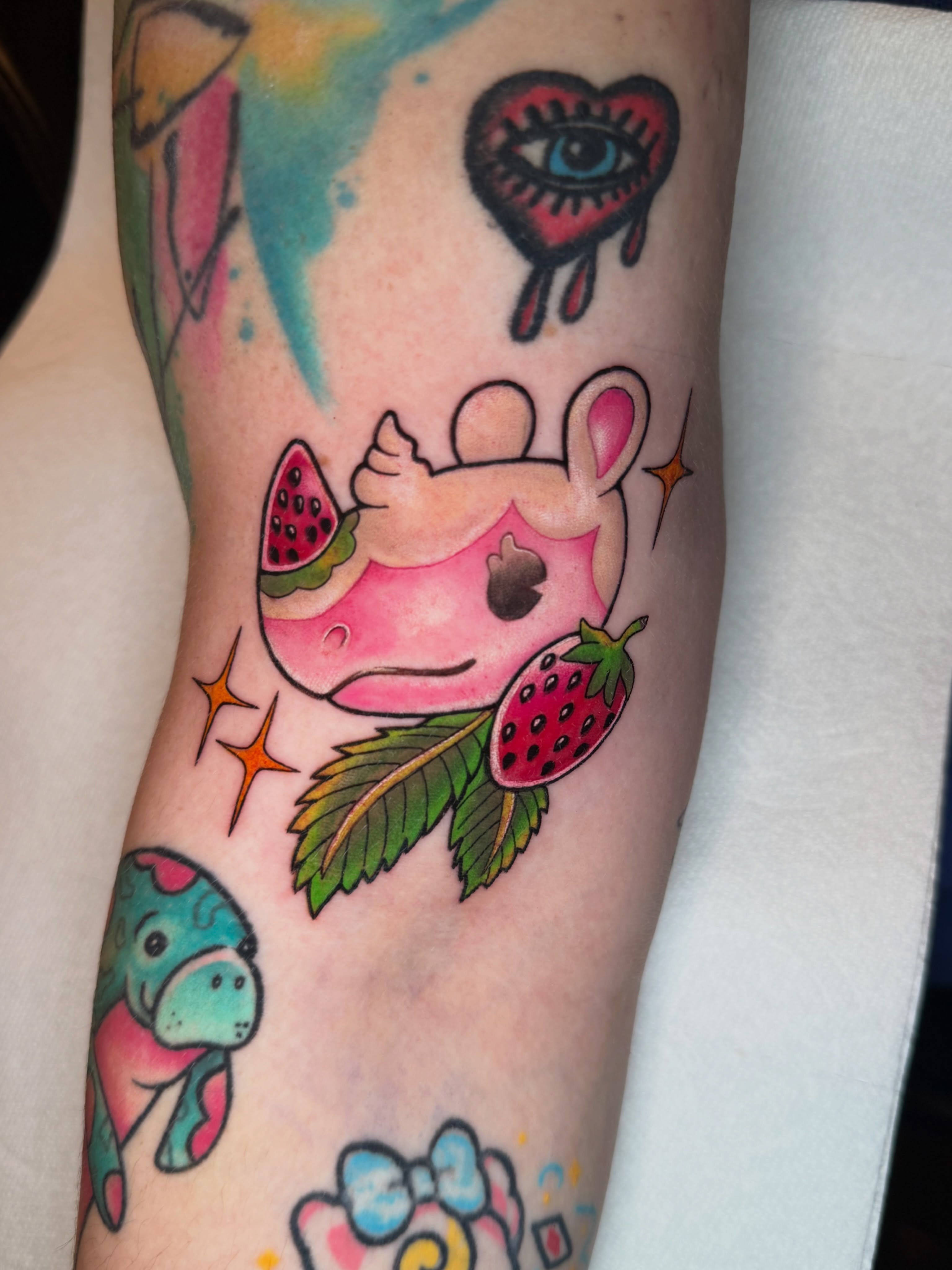 Pig with watermelon and strawberry new school tattoo on the forearm by Alexia