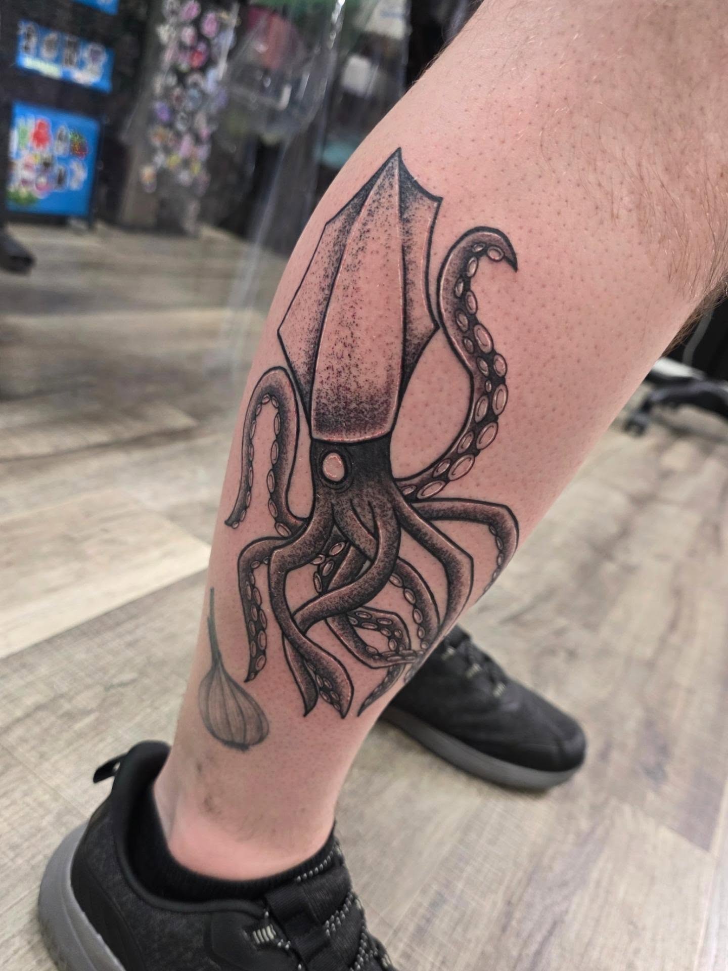 Squid black and grey tattoo on the forearm by Wray Saulsberry