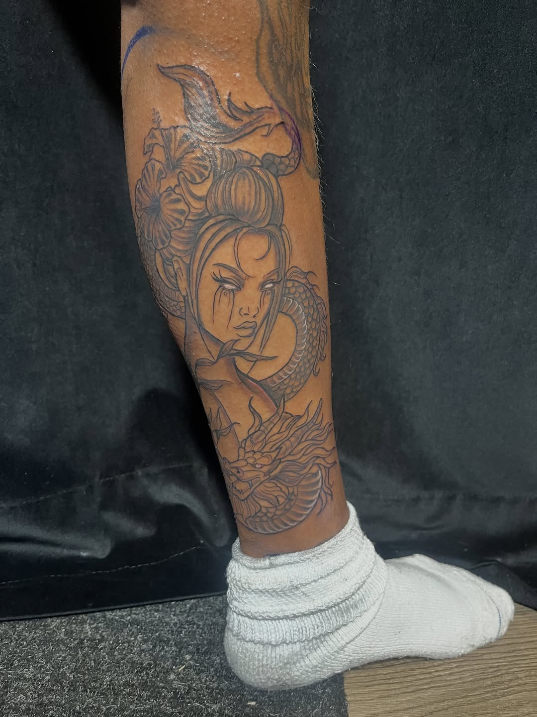 Woman and dragon Chicano tattoo on the calf by SpicyMvstardInkk