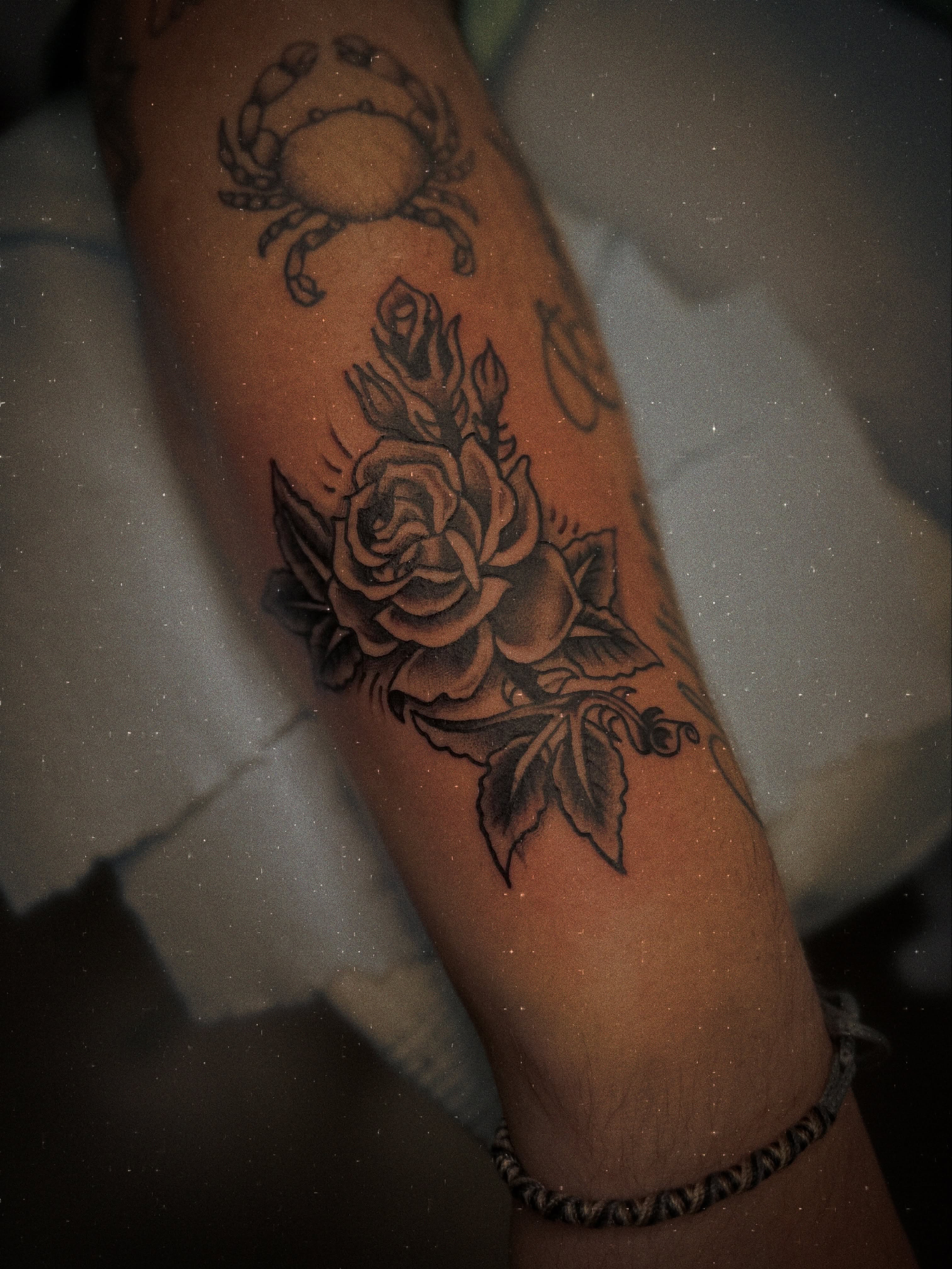 Rose and crab American traditional tattoo on the forearm by Ramón Silva