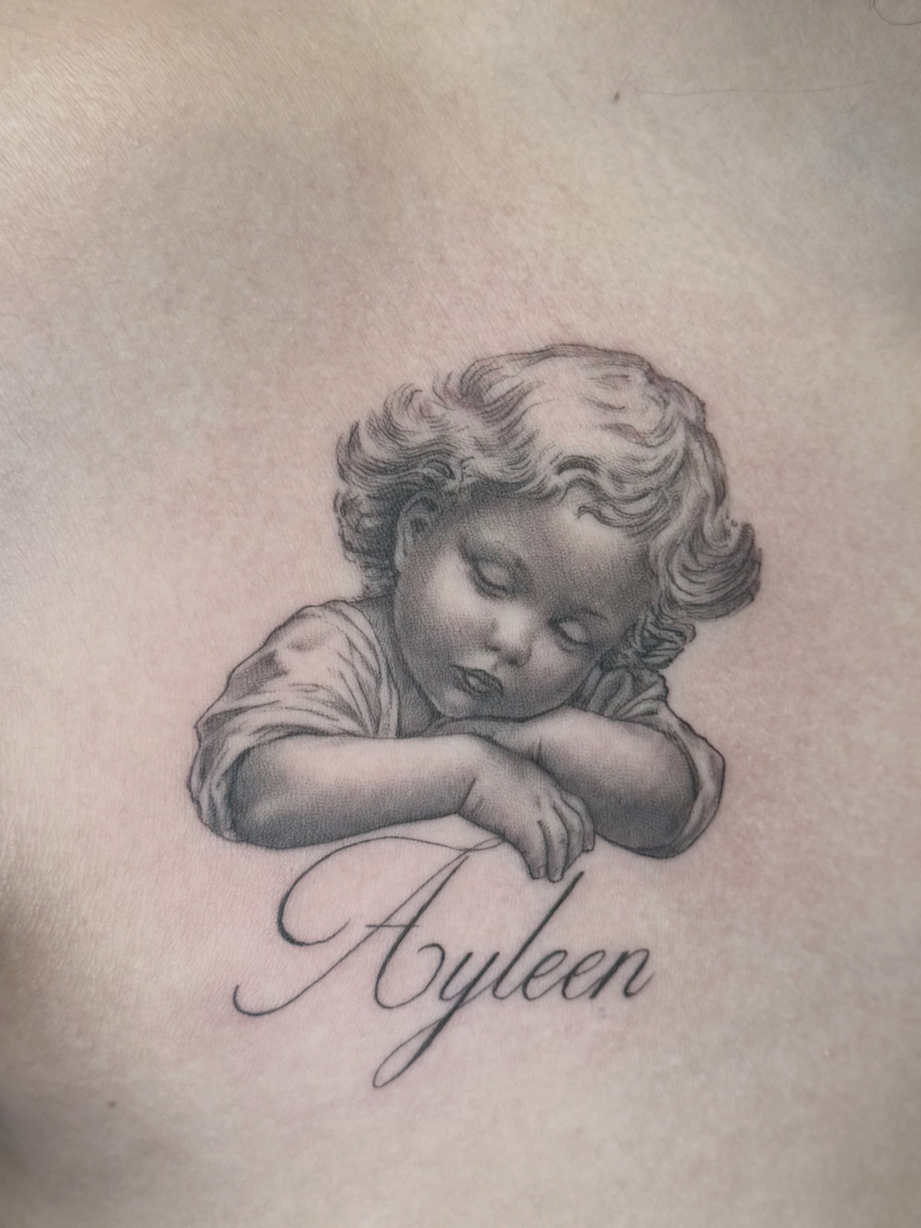 Sleeping child realism tattoo on the chest by Gilberto Flores Nava
