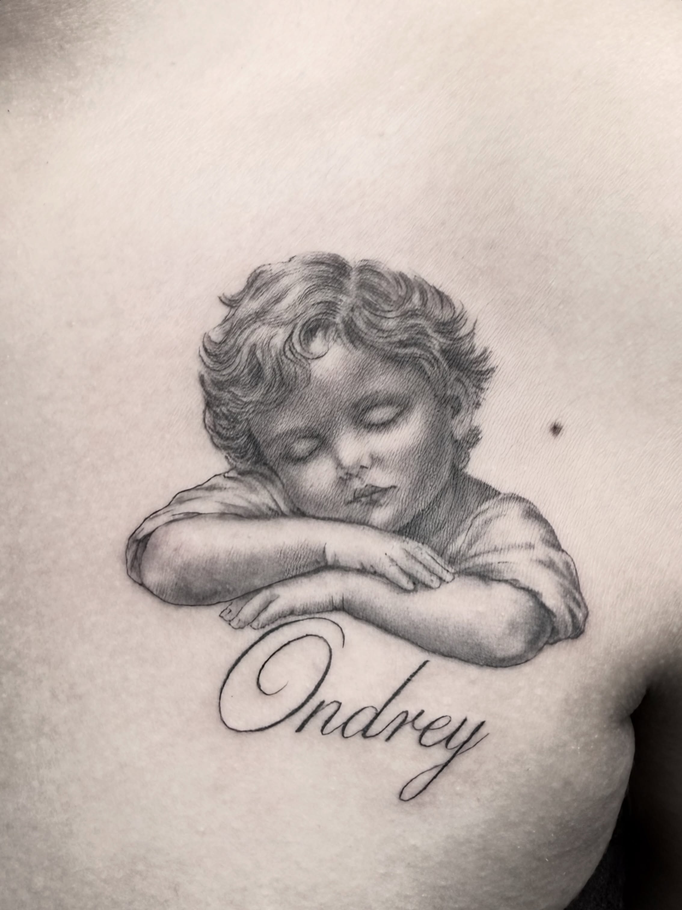 Sleeping child realism tattoo on the shoulder by Gilberto Flores Nava