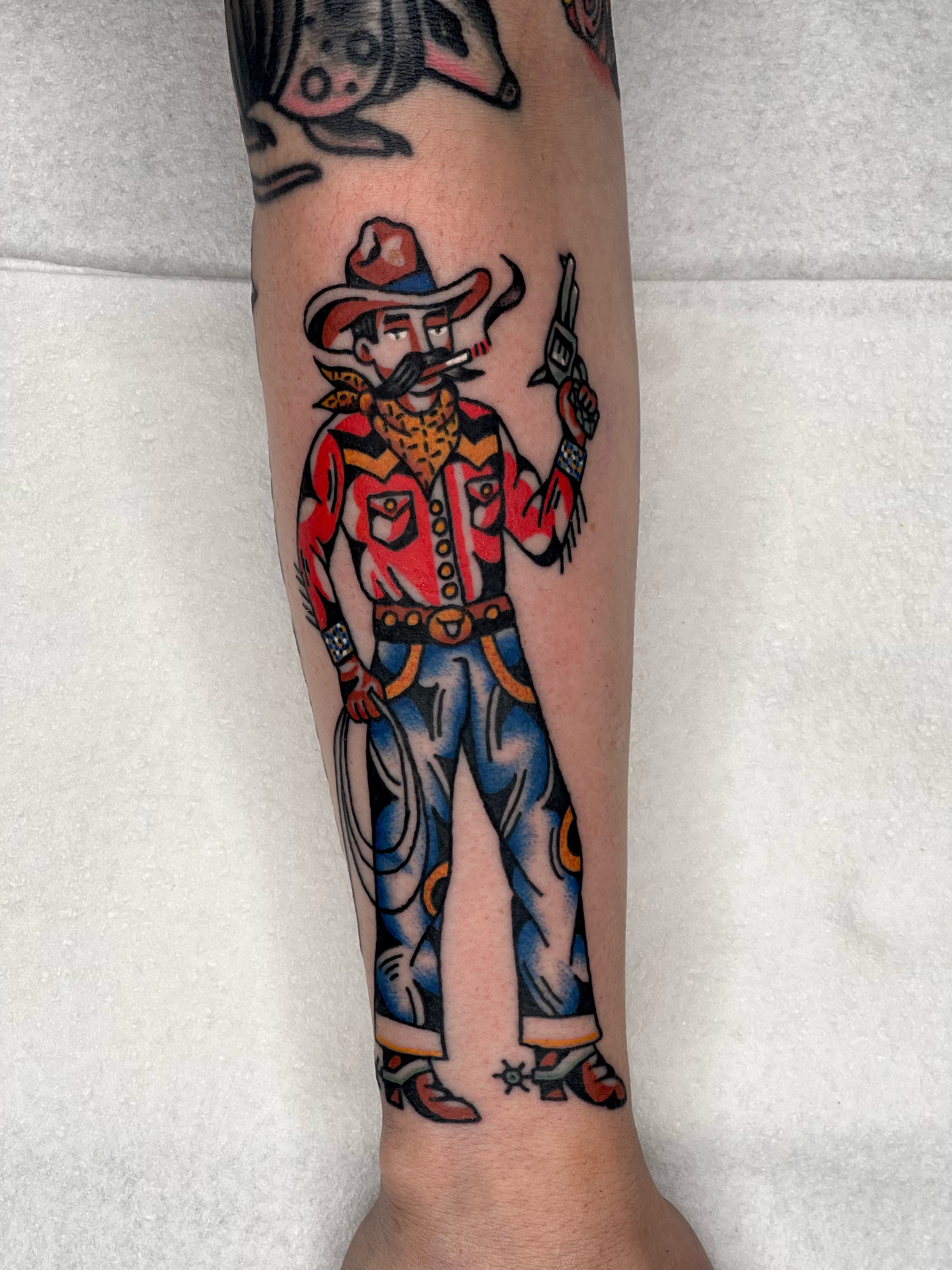 Cowboy character American traditional tattoo on the forearm by Christopher Durao
