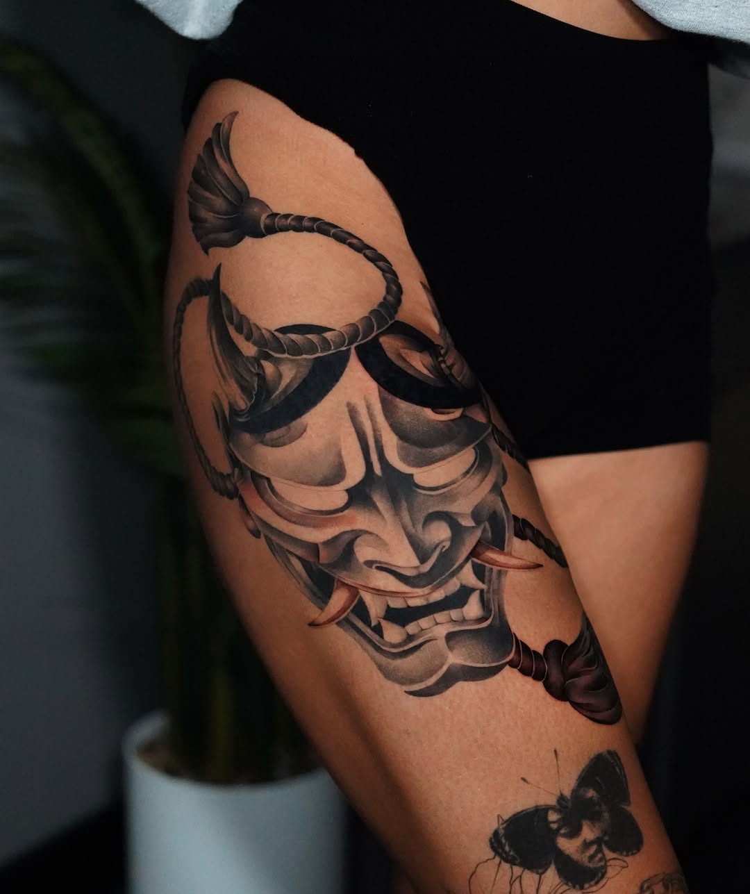 Oni mask with rope Japanese tattoo on the forearm by Espi