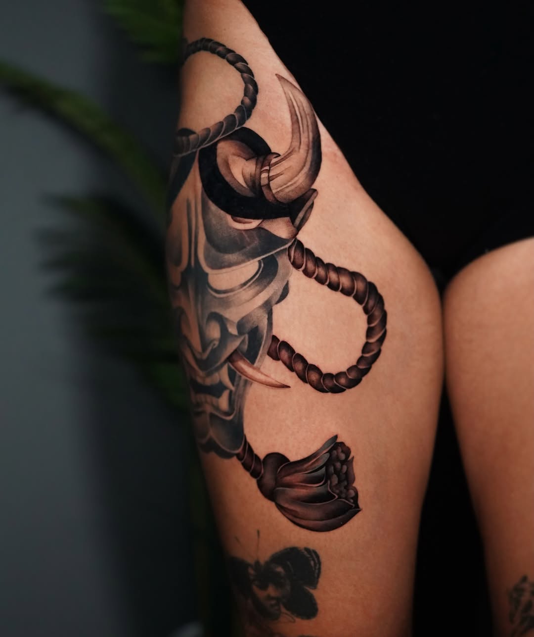 Oni mask with rope Japanese tattoo on the forearm by Espi