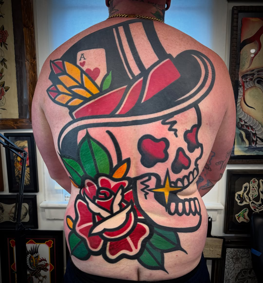 Skull and rose American traditional tattoo on the back by Jeremy Justice, New Orleans, Louisiana