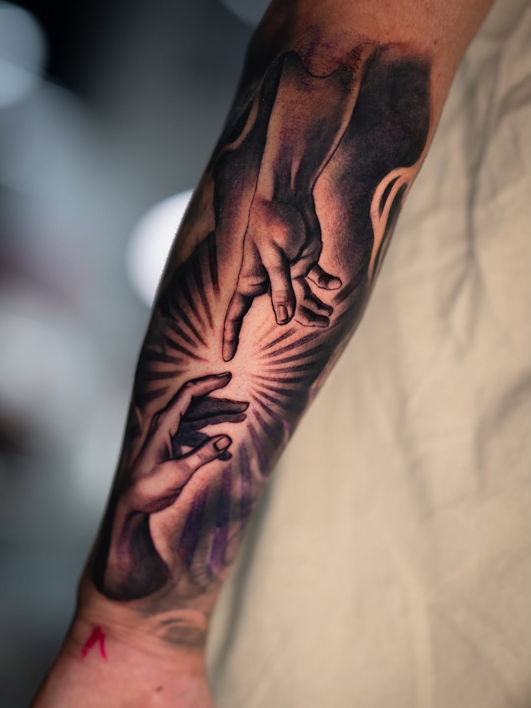 Two hands reaching realism tattoo on the forearm by Joey Hella Tattoo Artist