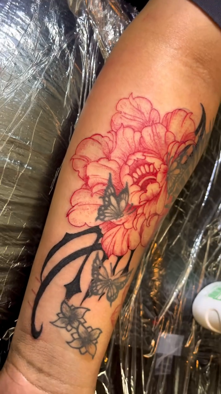Peony and butterflies neo-traditional tattoo on the forearm by Alejandro N Duran
