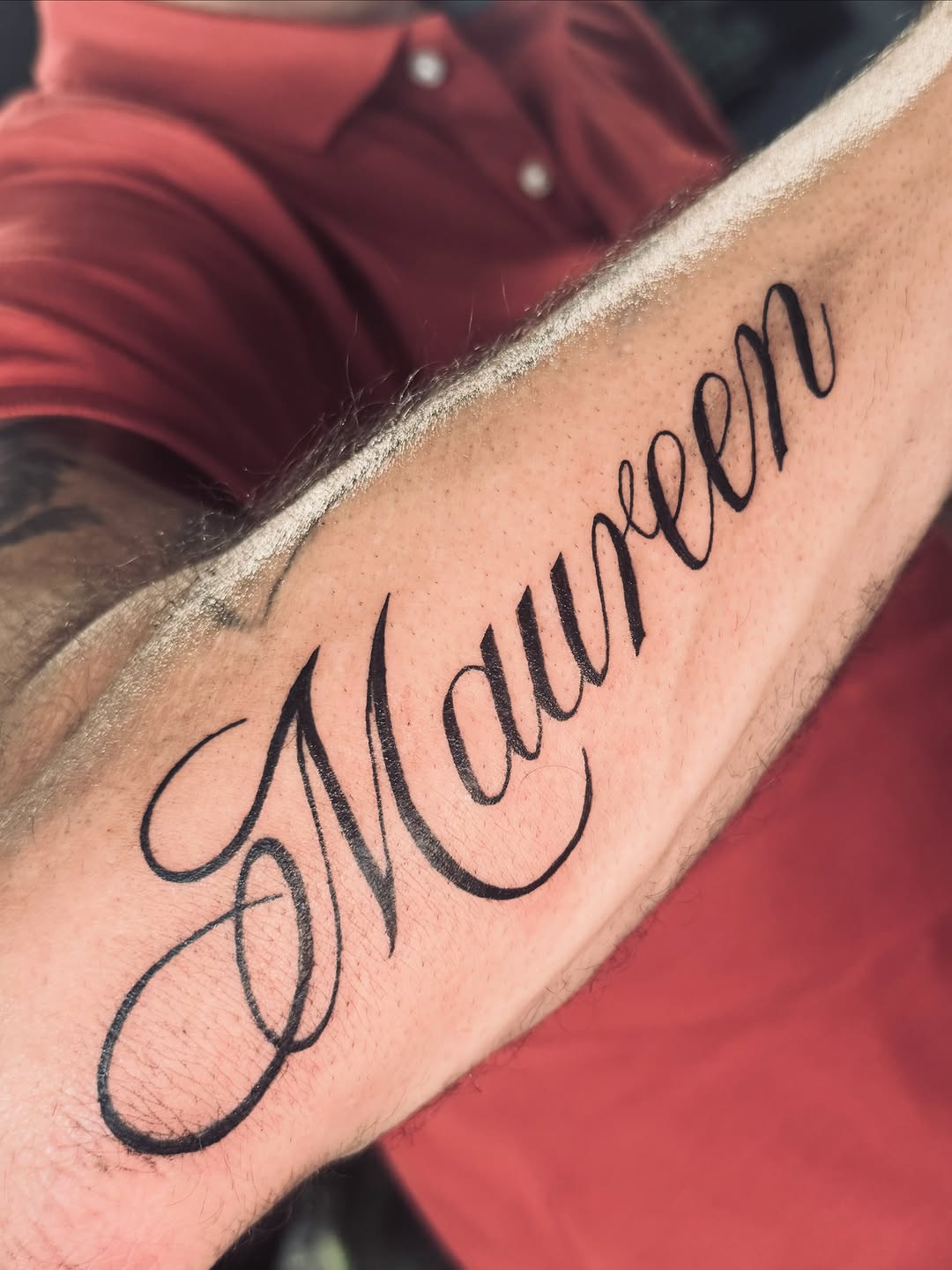 Maureen script name lettering tattoo on the forearm by Erik Pagtakhan