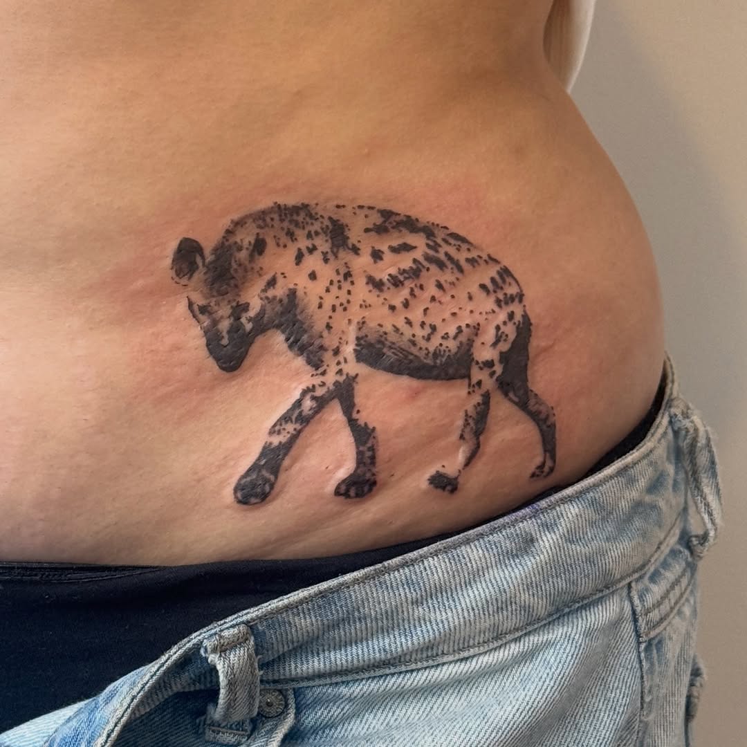 Hyena fine line tattoo by Kirsten