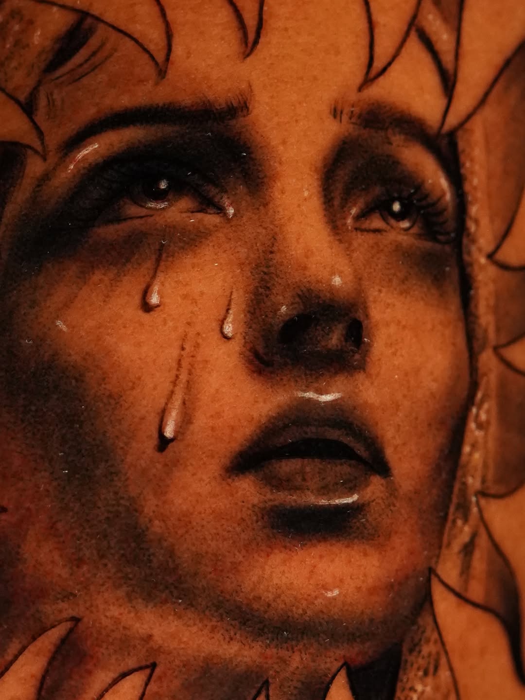 Crying woman's face realism tattoo on the head by Jennifer Garcia