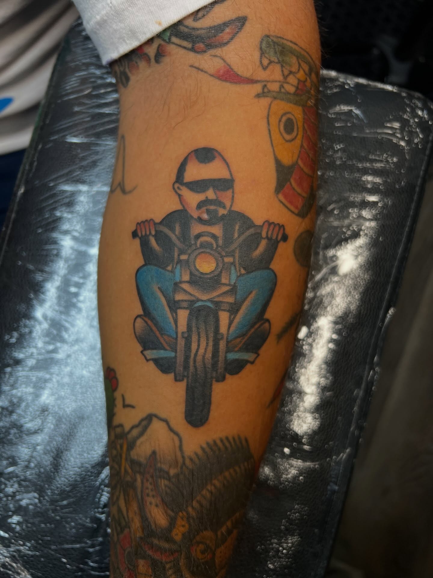 Motorcycle rider American traditional tattoo on the forearm by Tyler Van Pelt