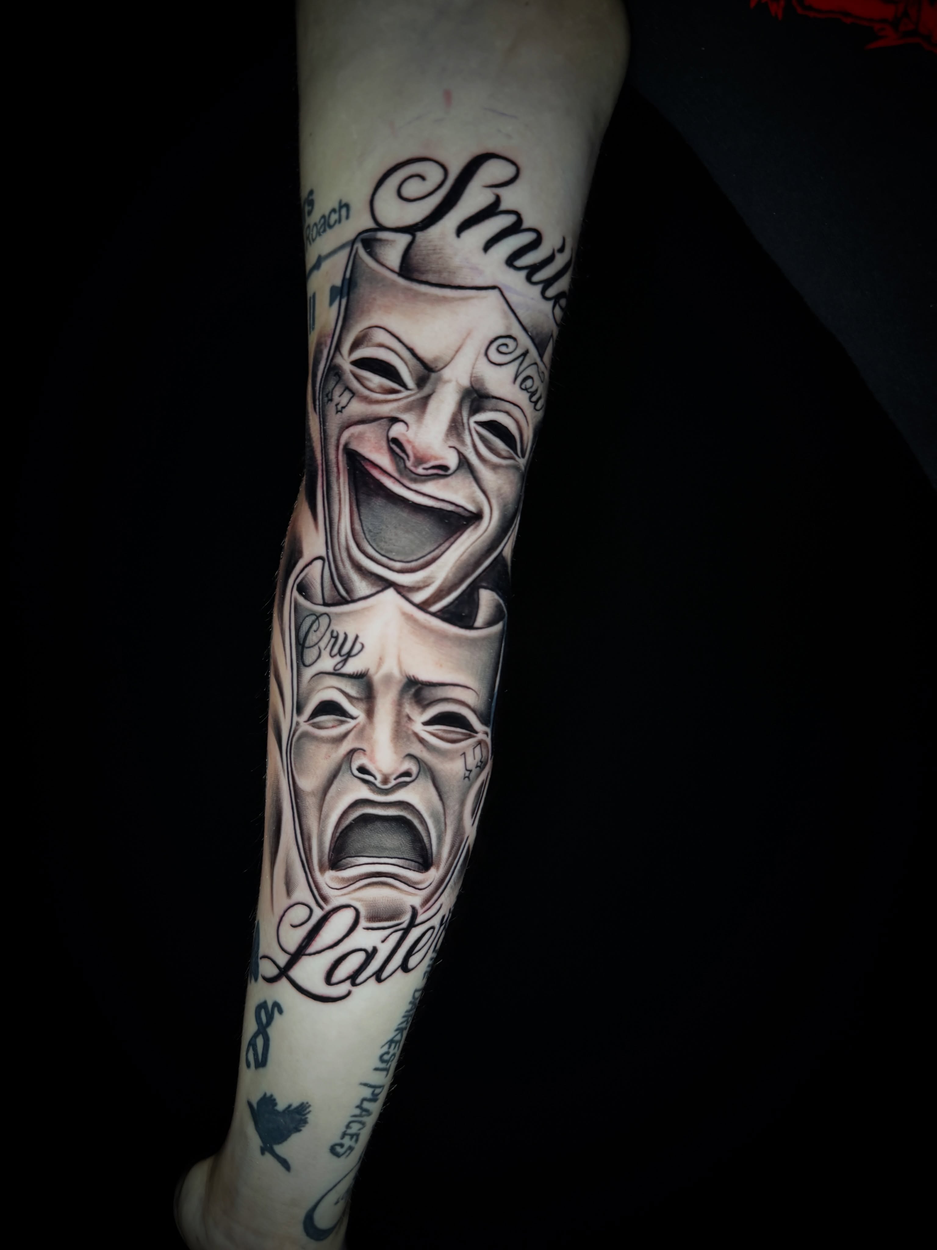 Theater masks realism tattoo on the forearm by Shane Fowler, Massillon, Ohio