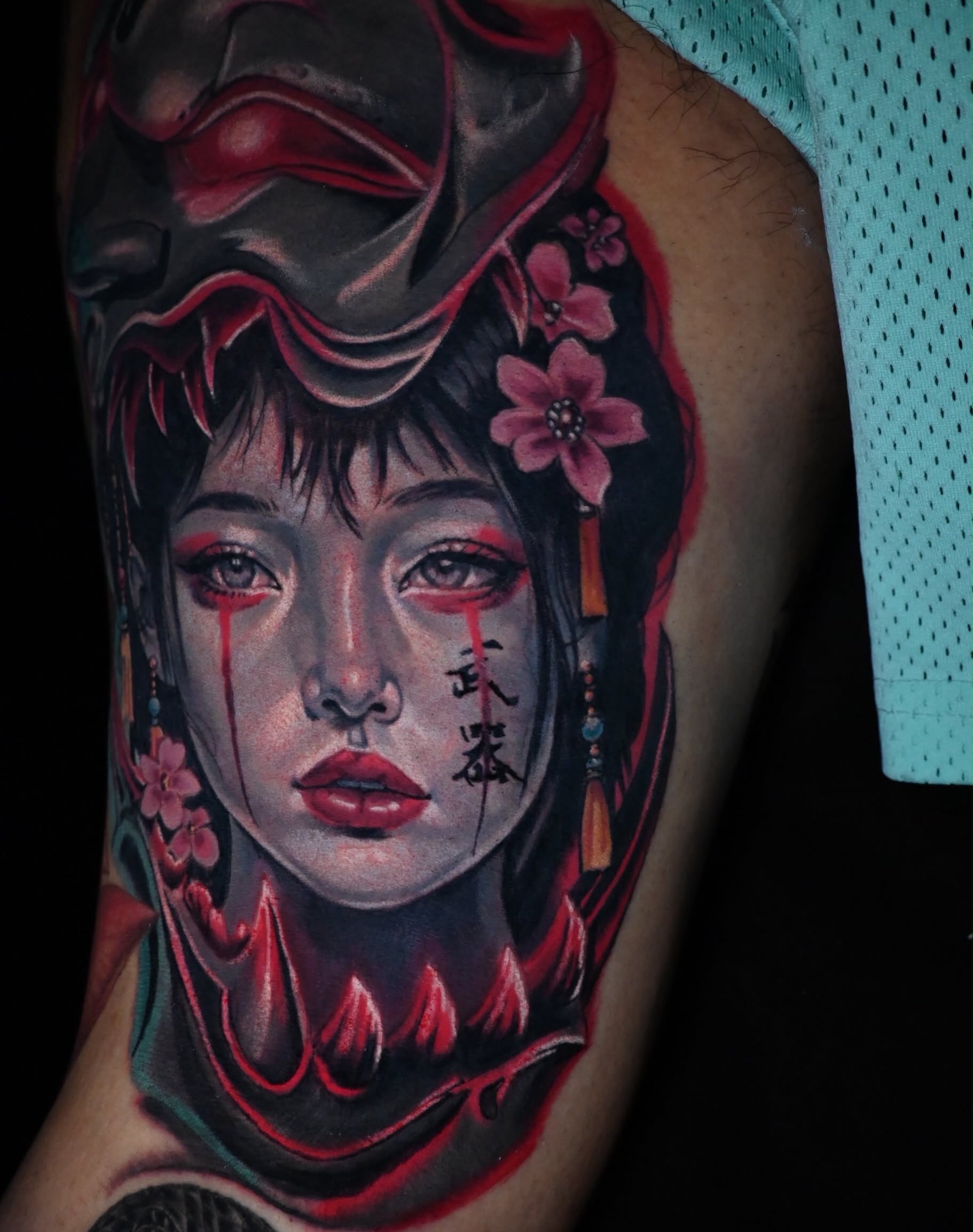 Geisha mask and face neo-traditional tattoo on the forearm by William Pollock