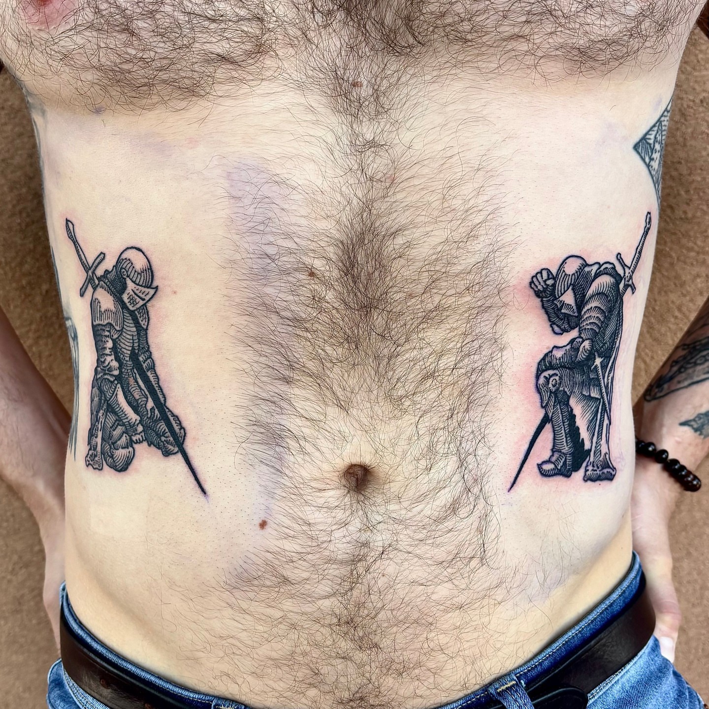 Knights black and grey tattoo on the torso by ๐๐๐ ๐๐๐๐๐๐๐๐๐๐๐