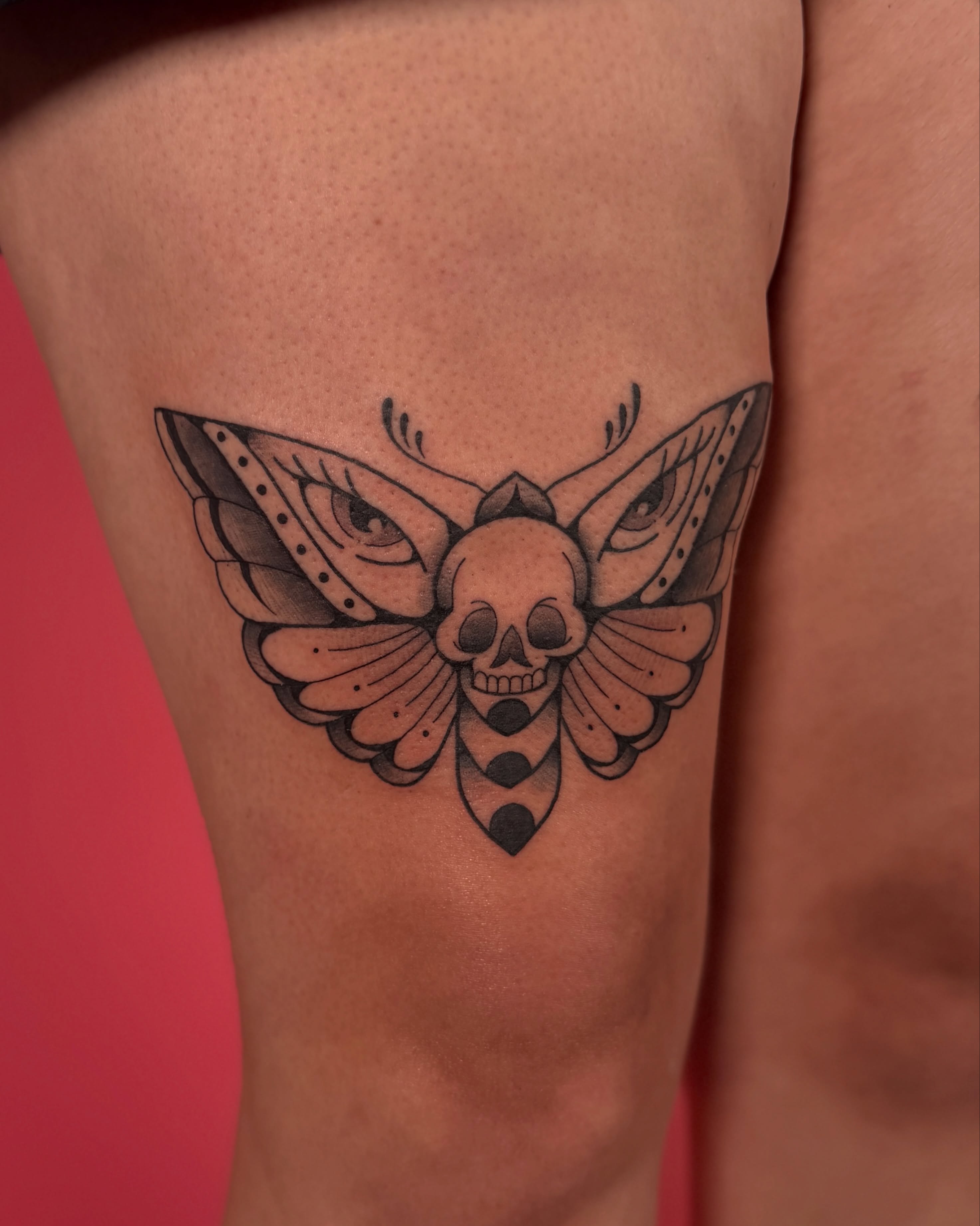Moth skull black and grey tattoo on the thigh by Kail