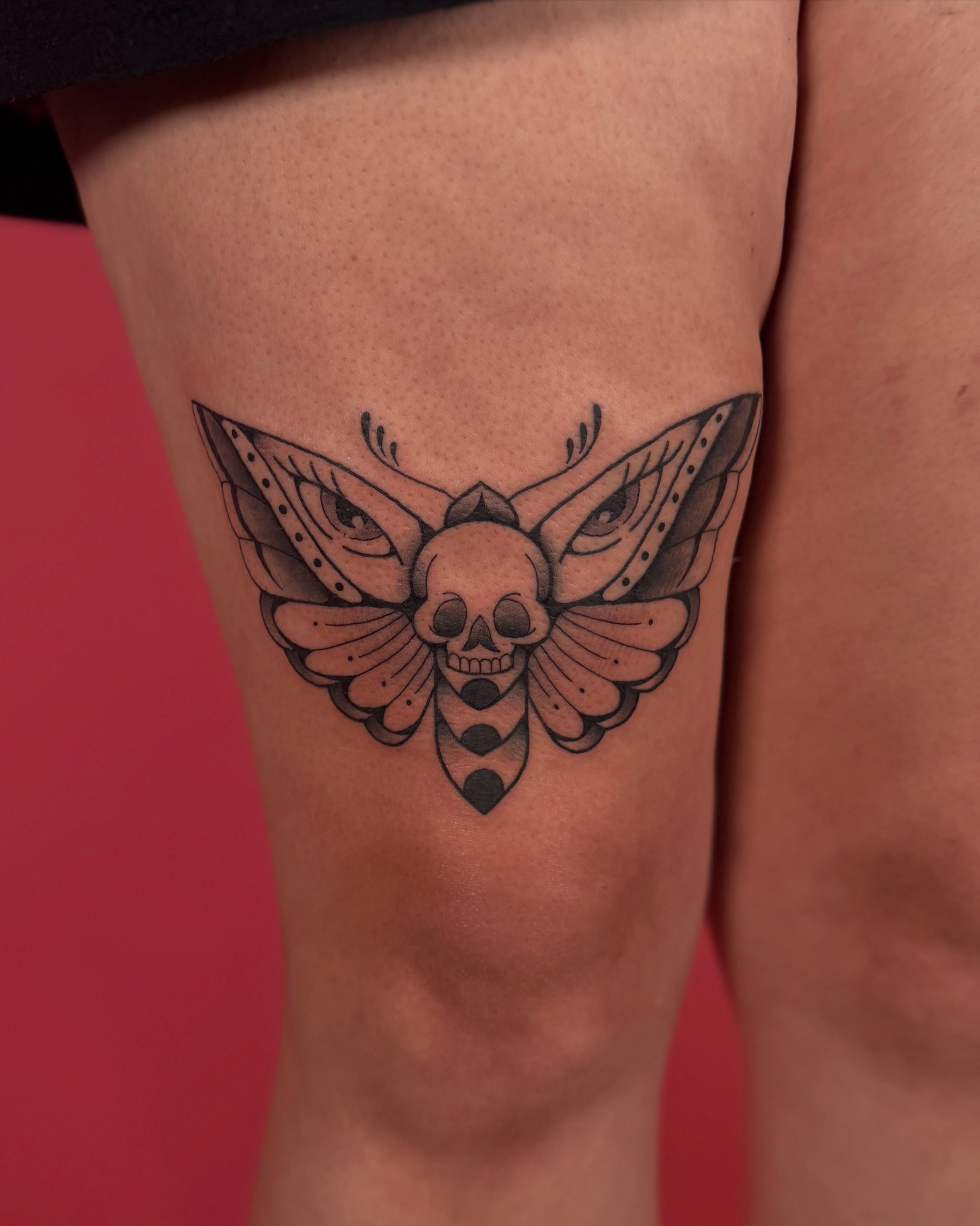 Skull moth black and grey tattoo on the thigh by Kail