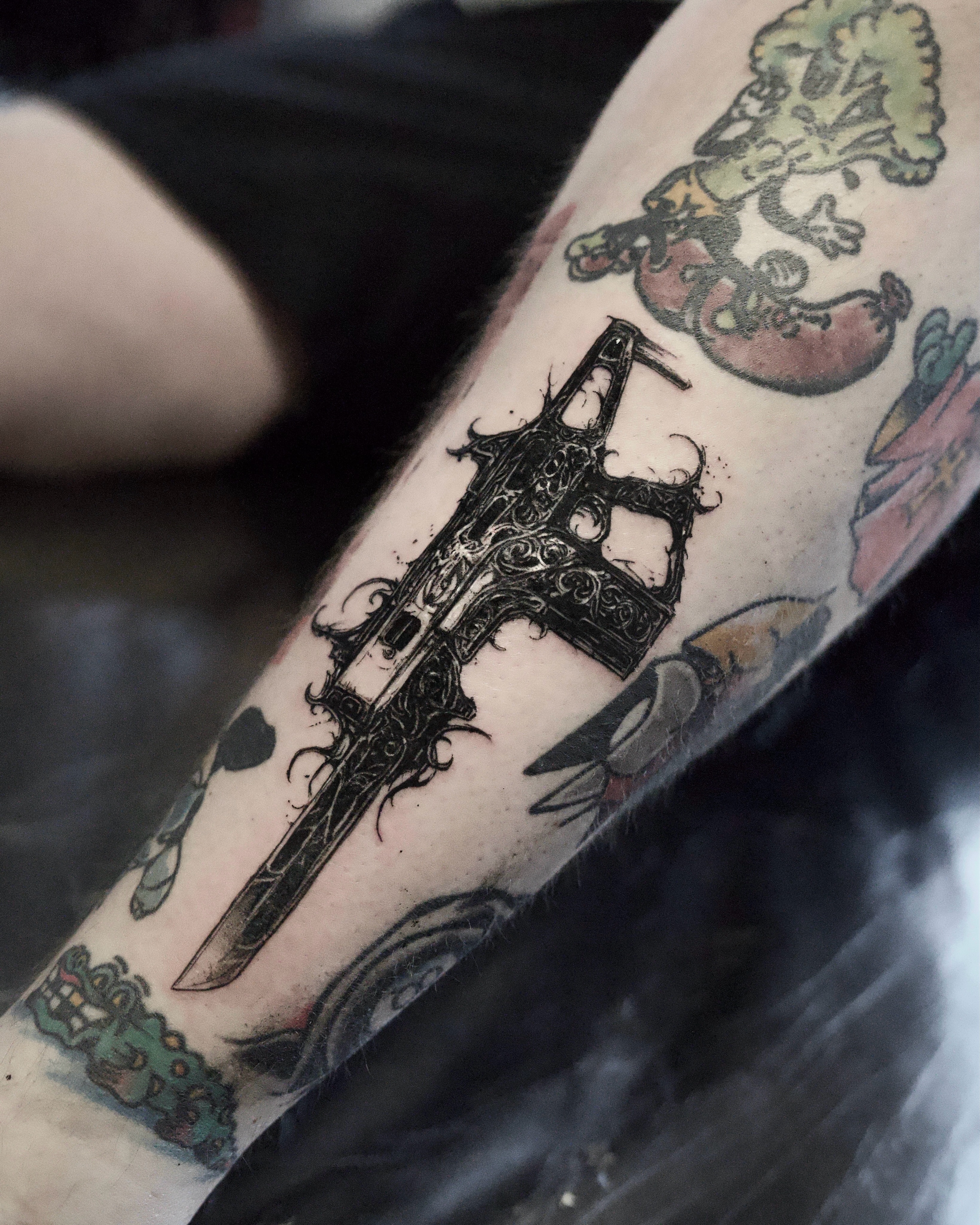 Ornate gun cyber sigilism tattoo on the forearm by Gun