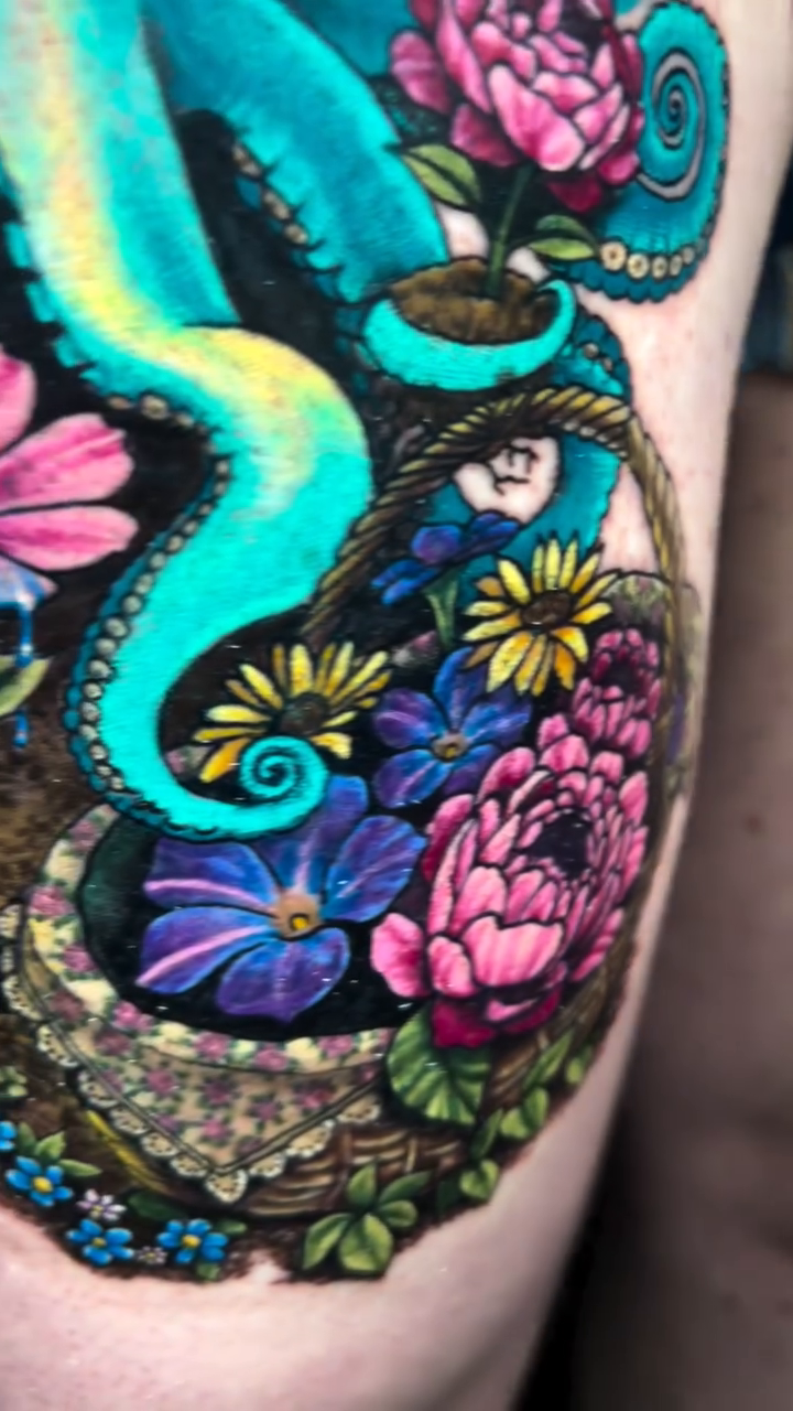 Octopus in a hat with flowers neo-traditional tattoo on the thigh by Paisley Diaz, Lombard, Illinois