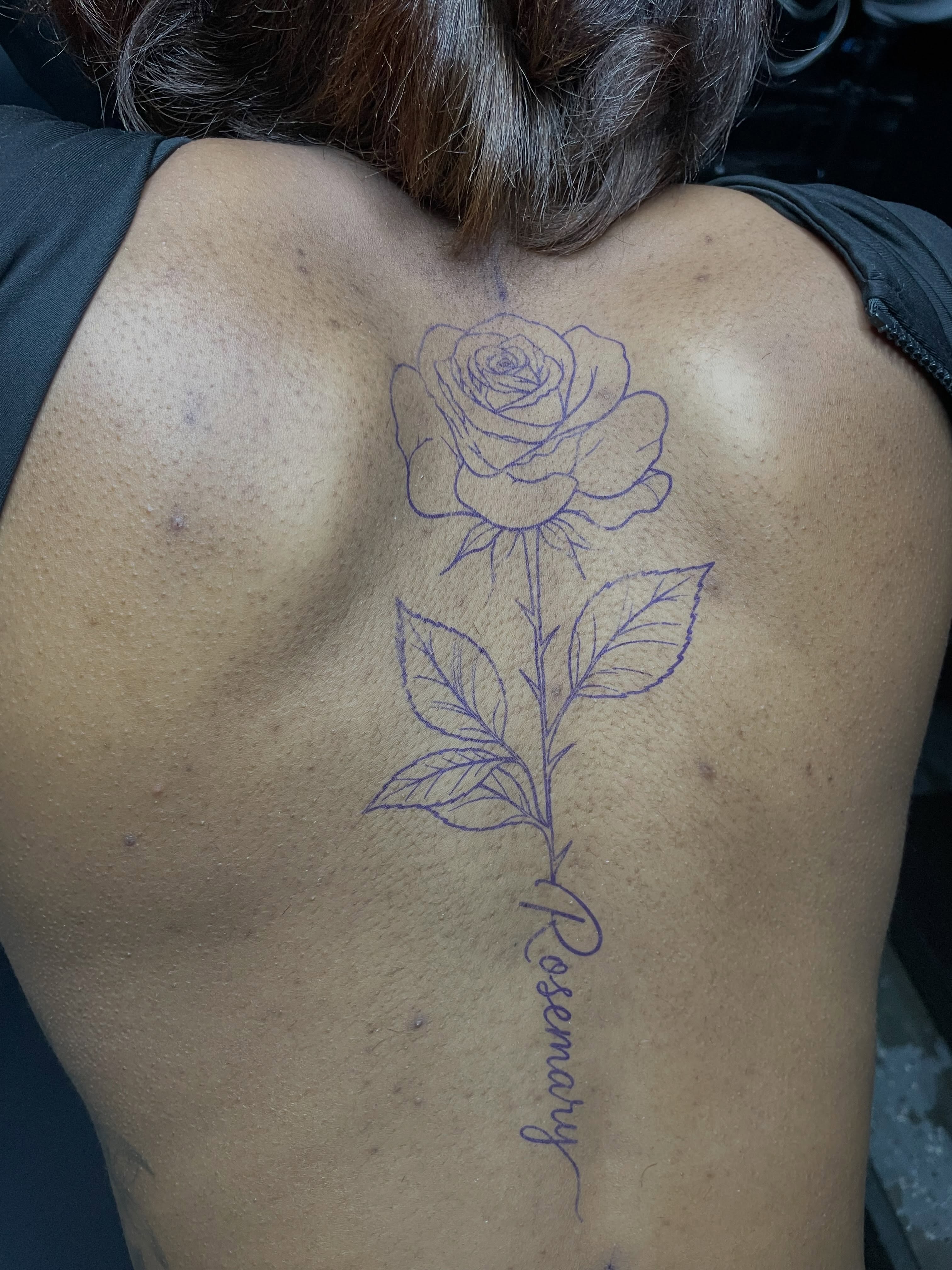 Rose fine line tattoo on the back by TreCashTats💉🩸 MisfitzTattooStudio