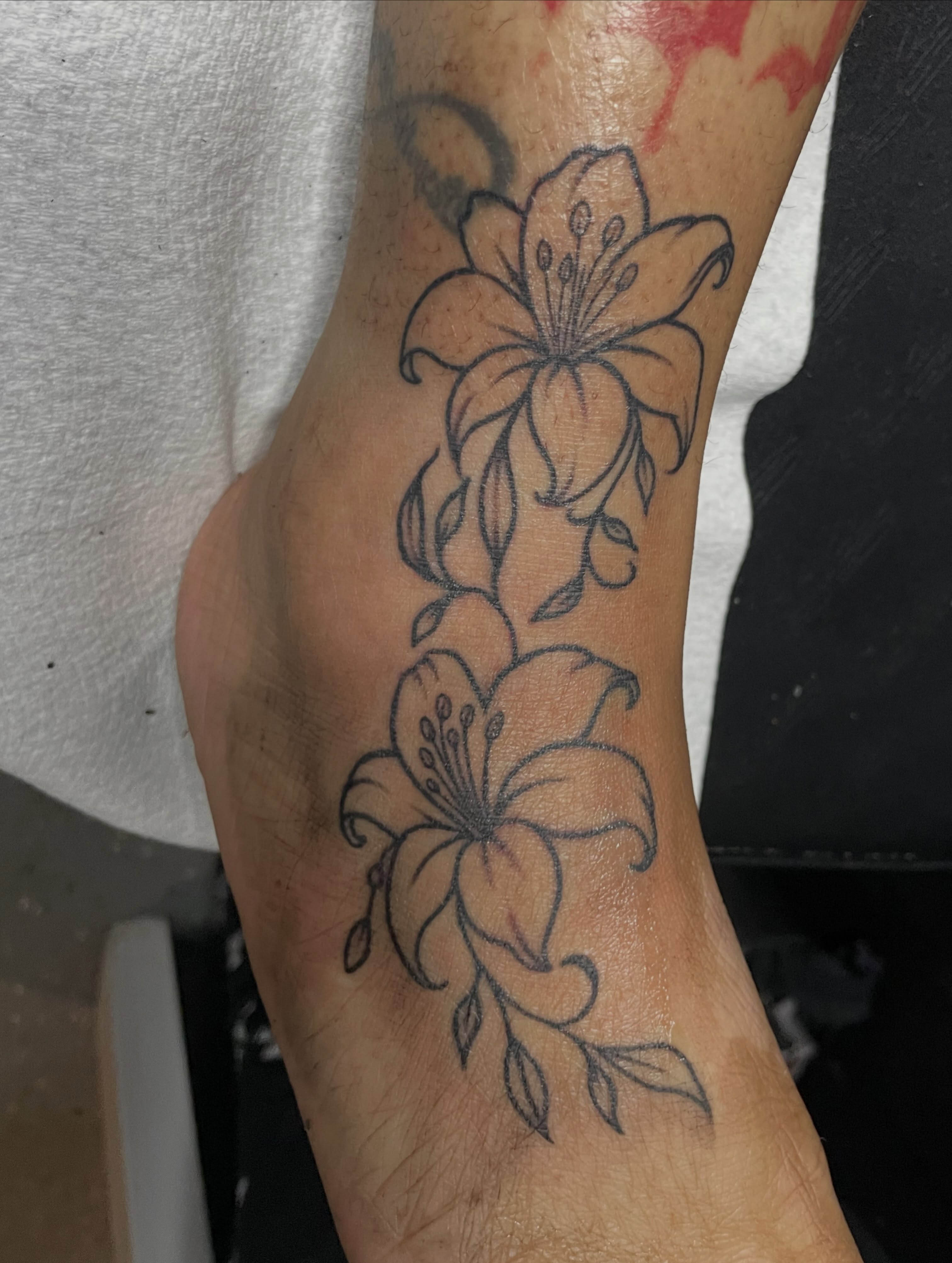 Lily flowers black and grey tattoo on the forearm by TreCashTats💉🩸 MisfitzTattooStudio