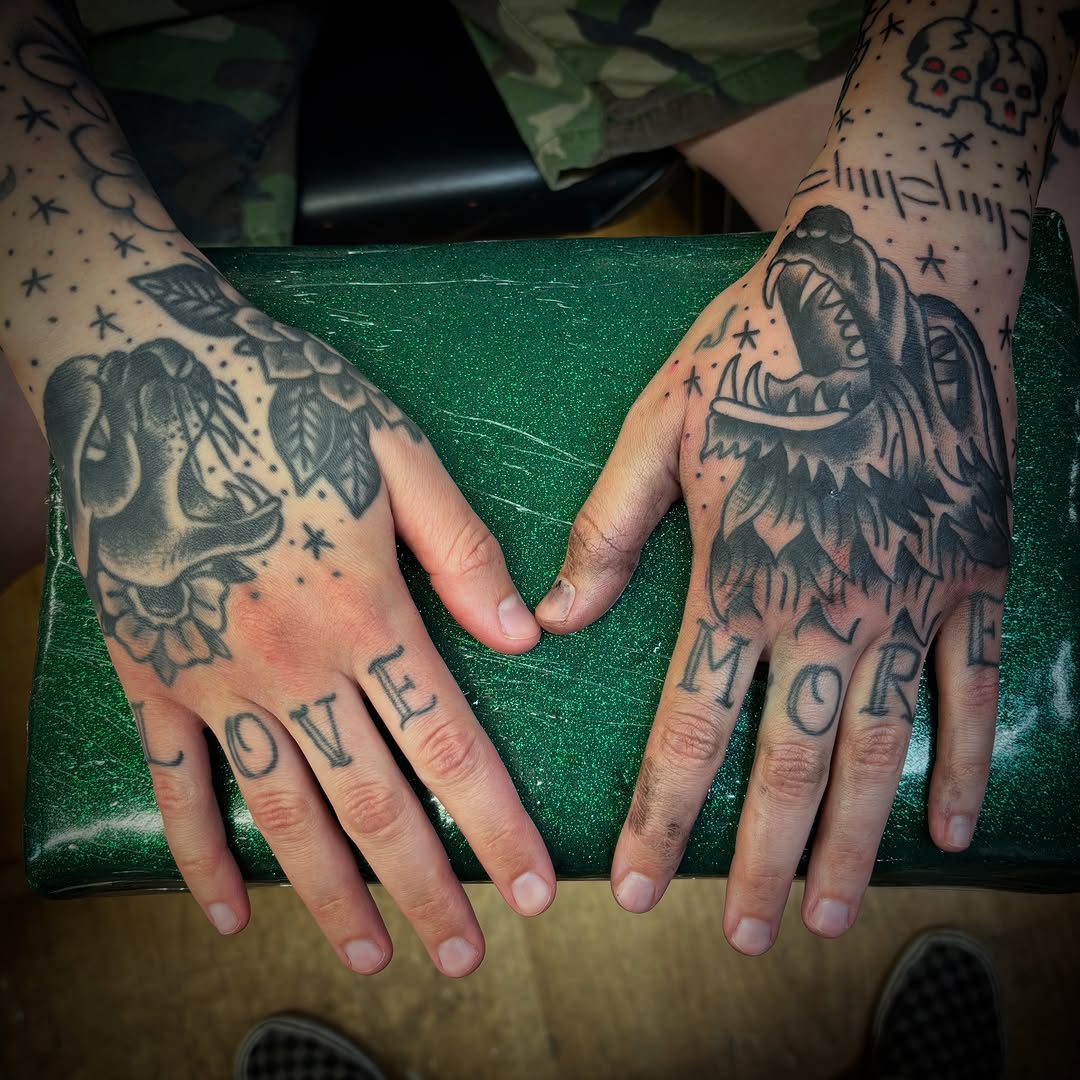 Wolf head and rose tattoo on the hand by Tattoos Las Vegas,NV