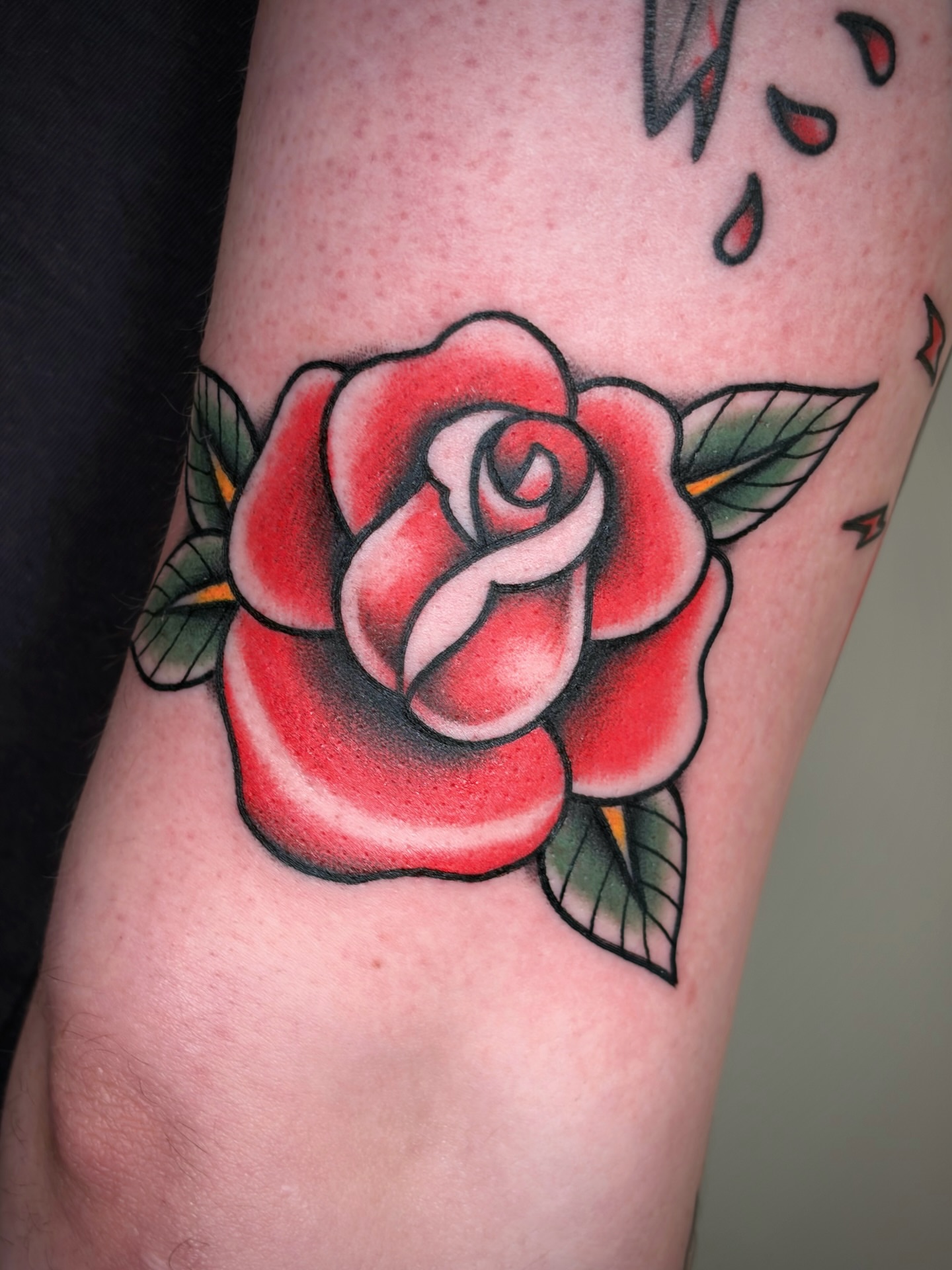 Rose American traditional tattoo on the forearm by Black and color tattoo!
