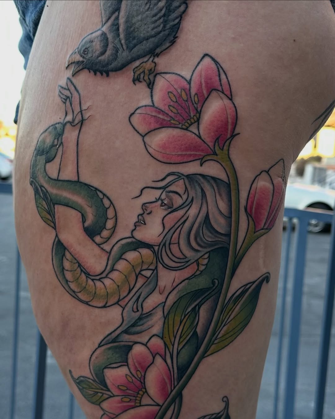 Woman with snake and bird neo-traditional tattoo on the thigh by Leslie Luck Tattoos