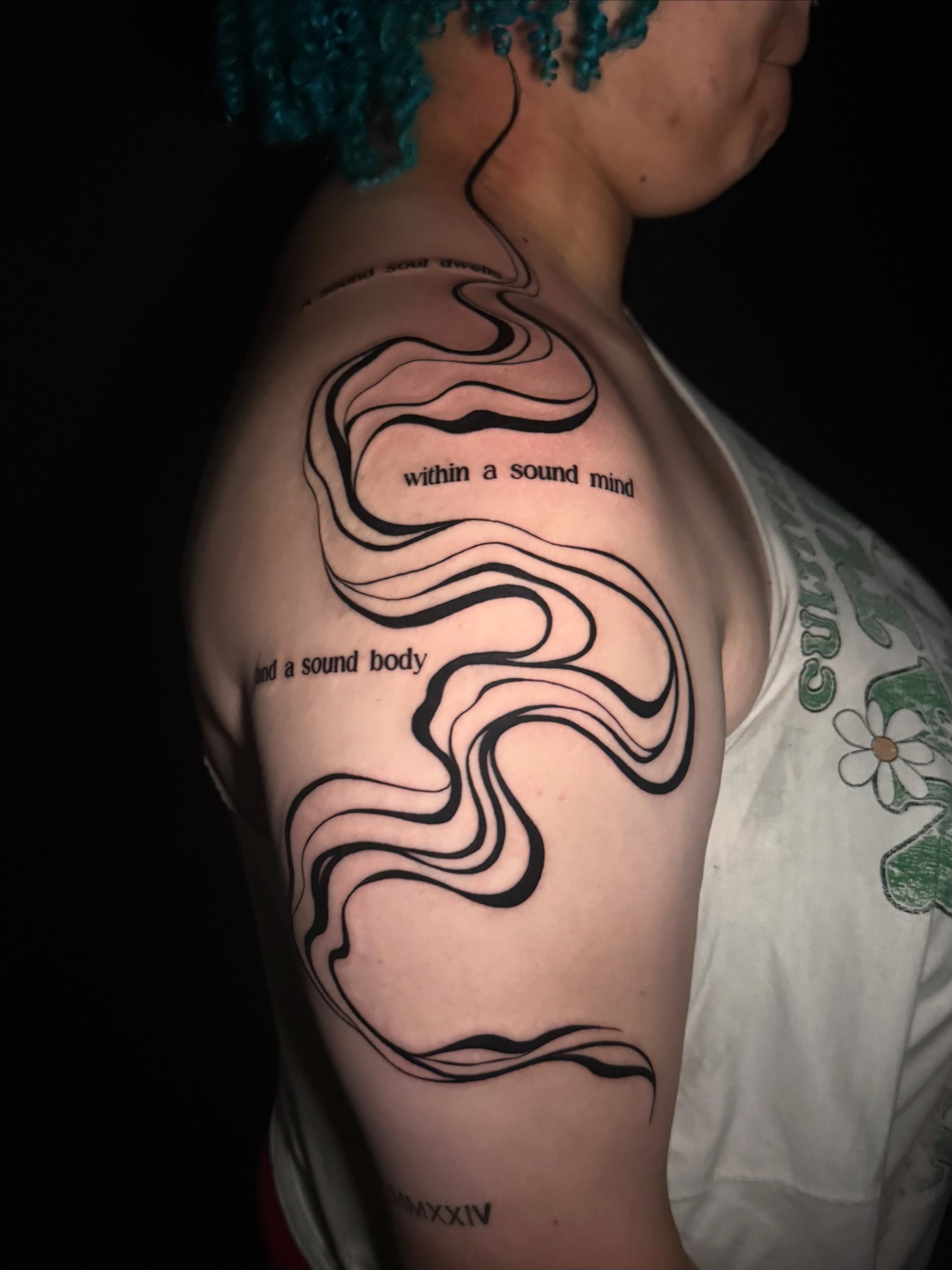 Wave pattern fine line tattoo on the shoulder by Lauren B