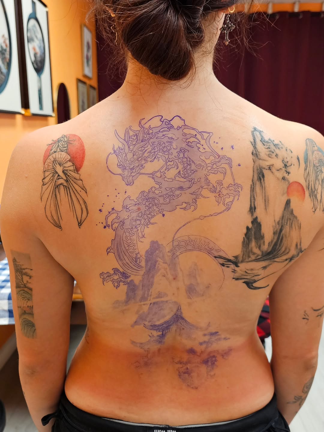 Dragon and landscape dotwork tattoo on the back by Lili Gu