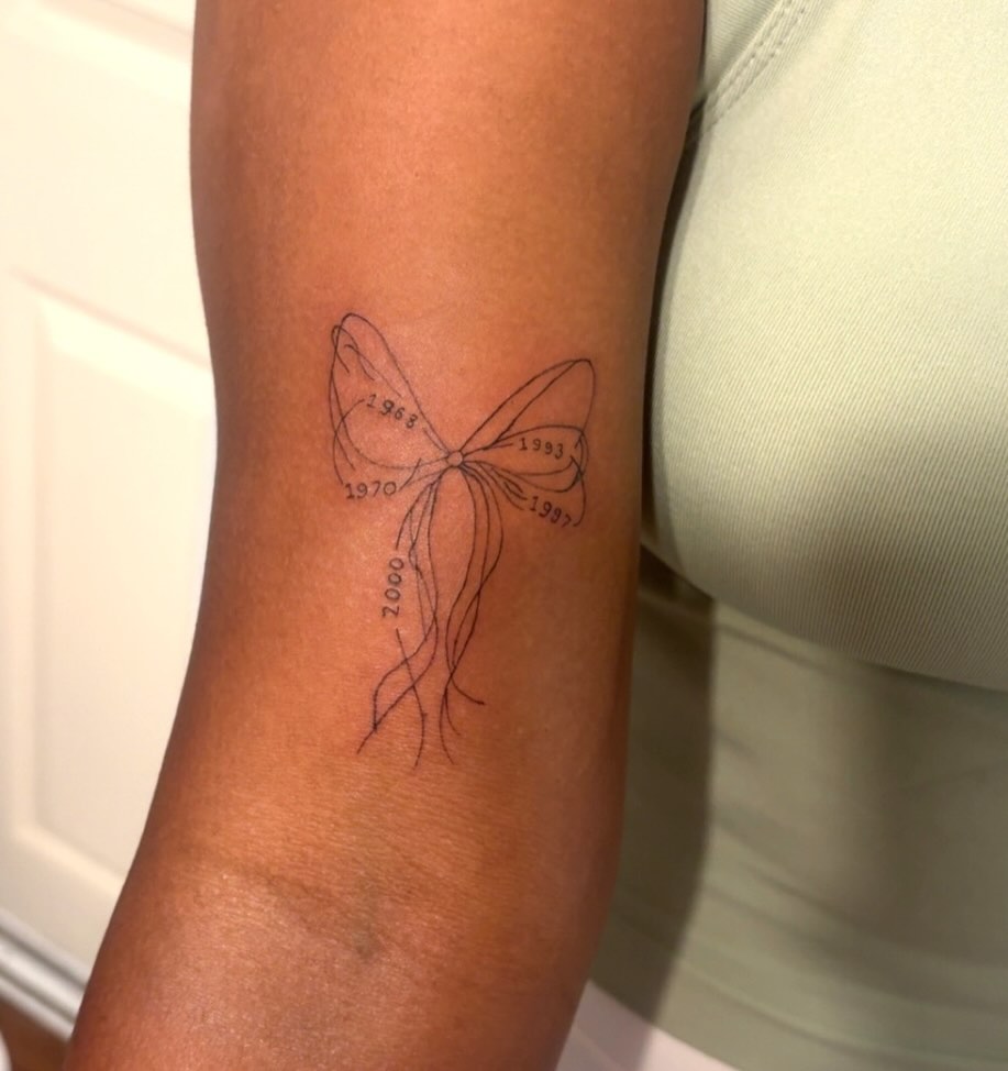 Butterfly fine line tattoo on the forearm by Victoria Cooper