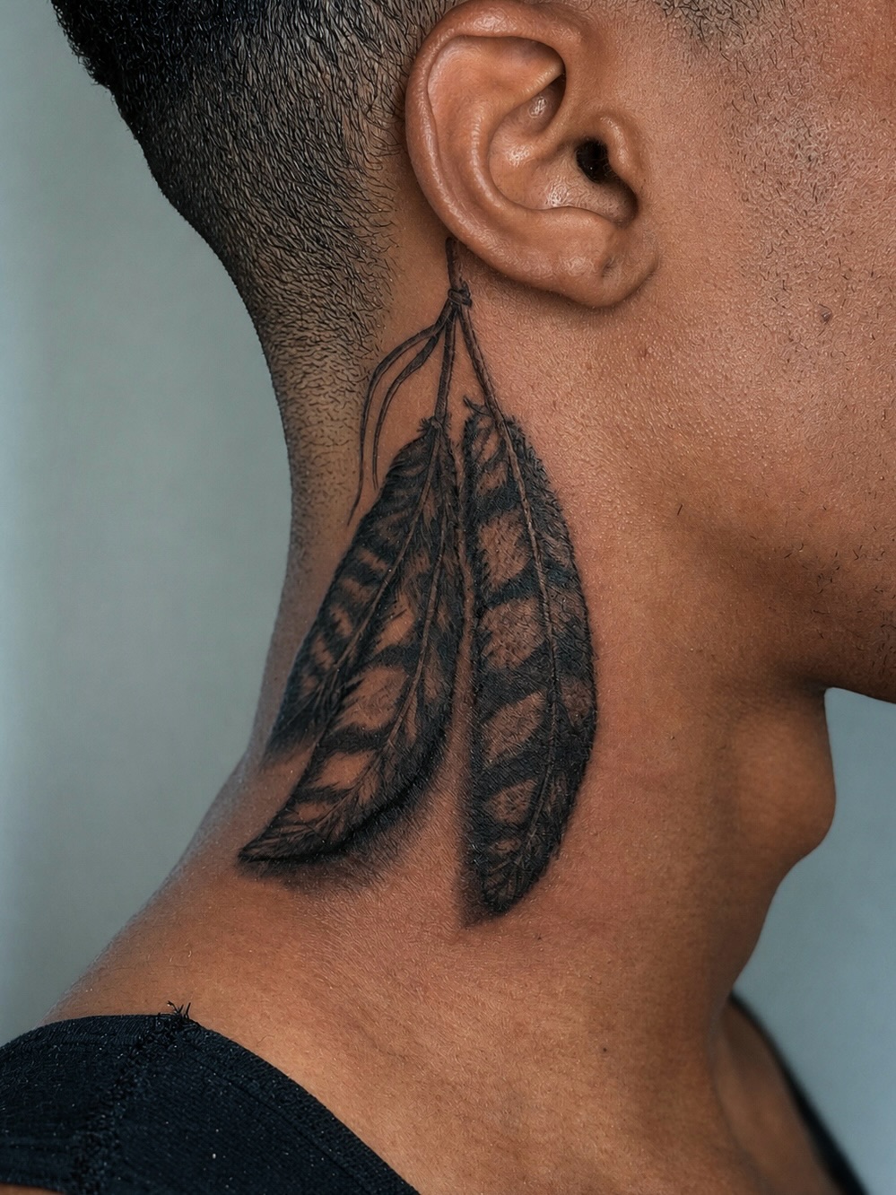 Feather black and grey tattoo on the neck by ππππππ