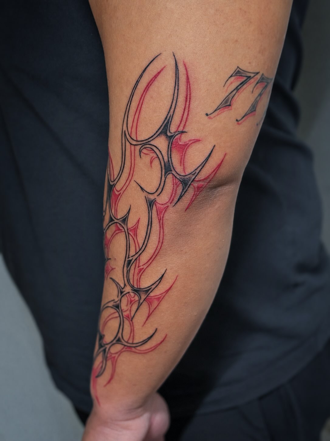 Flame design tribal tattoo on the forearm by ππππππ