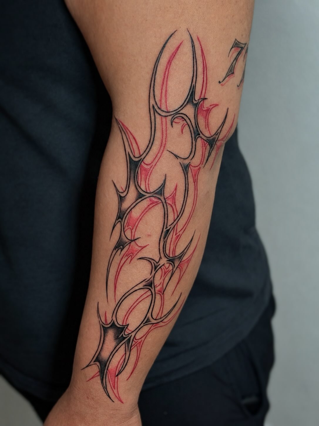 Flame design tribal tattoo on the forearm by ππππππ