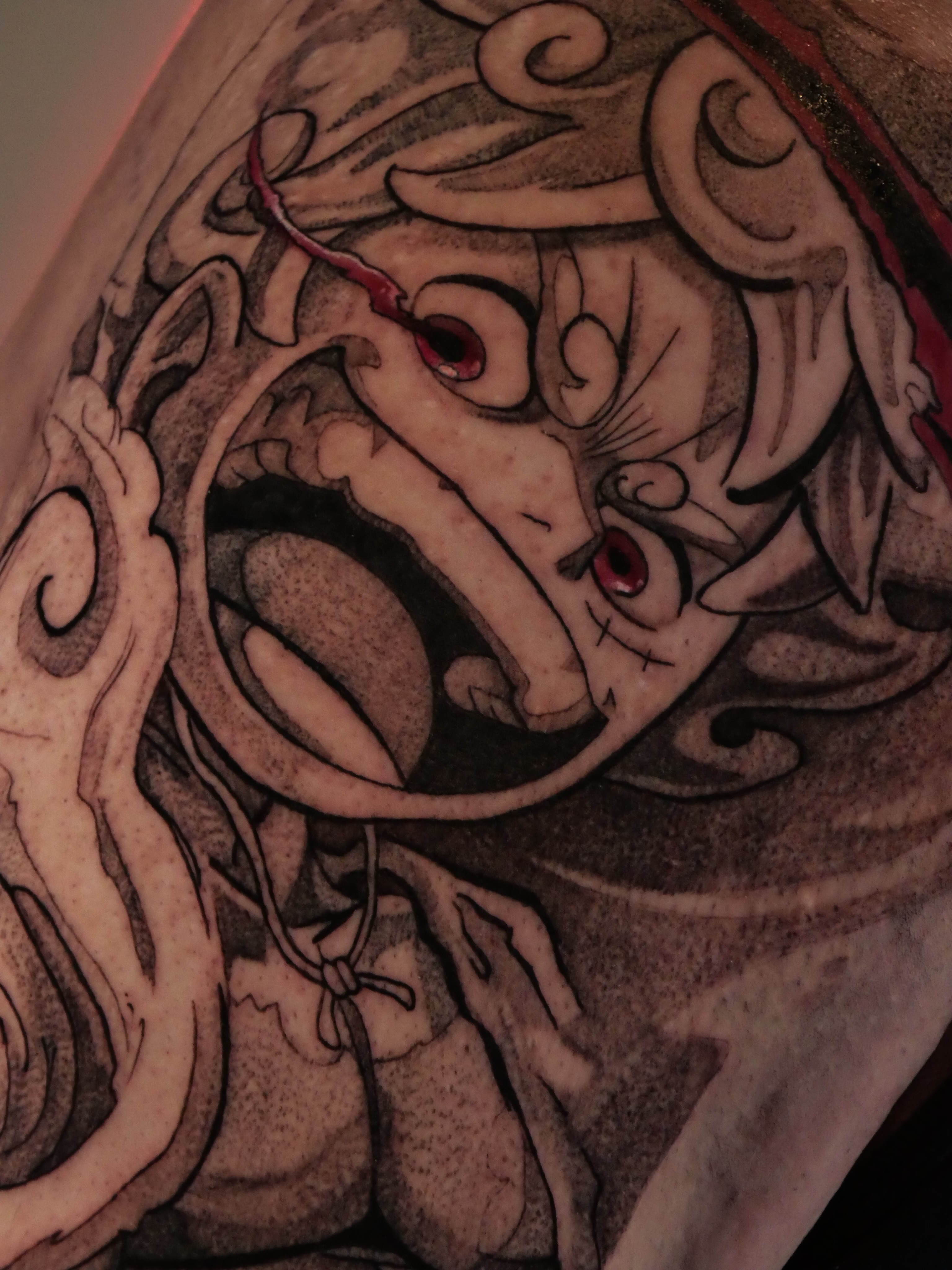 Demon dotwork tattoo on the shoulder by Sloppy