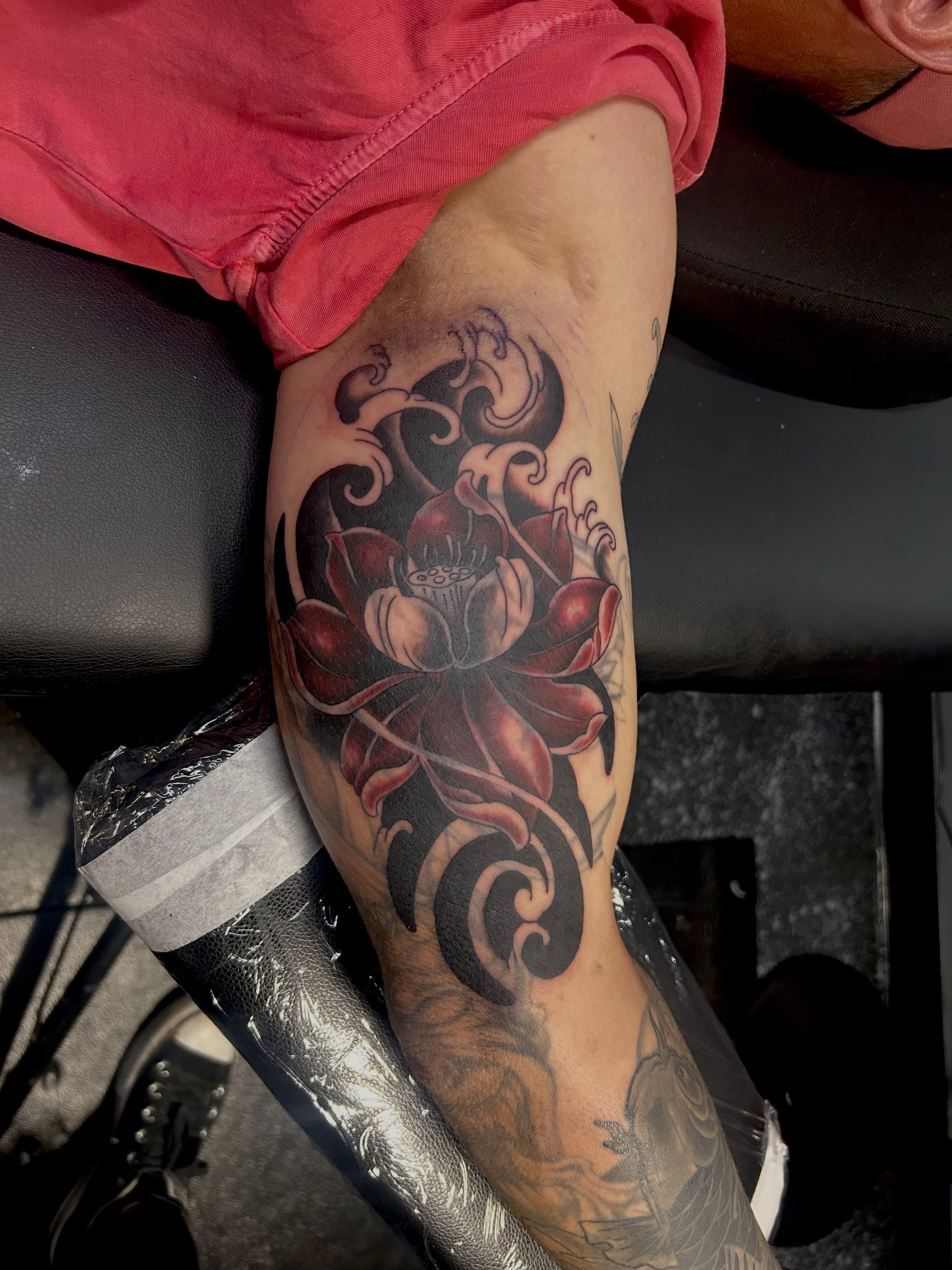 Lotus flower black and grey tattoo on the forearm by Jamie Winn
