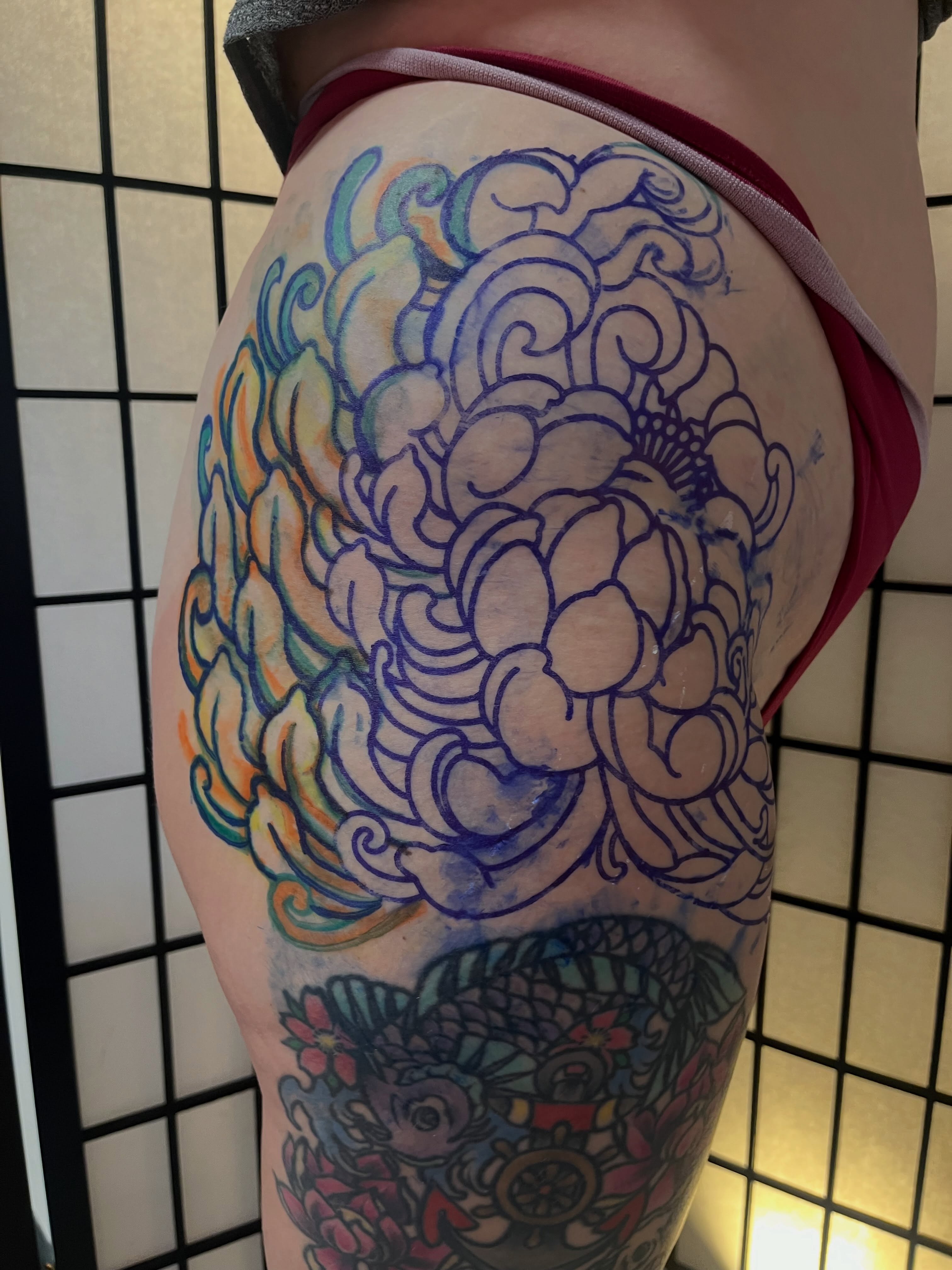 Chrysanthemum japanese irezumi tattoo on the thigh by Lauryn Dunkle